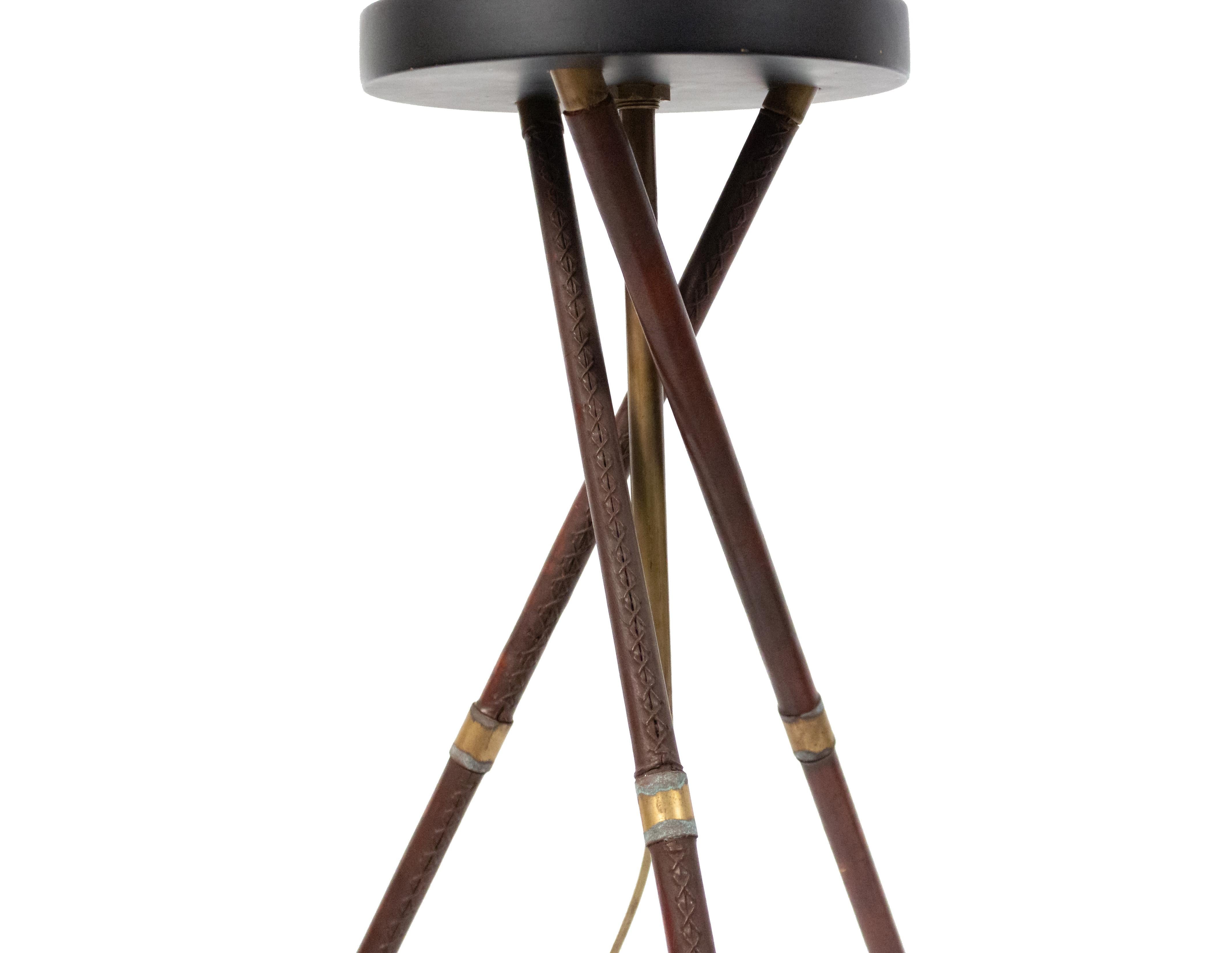 Midcentury French novelty metal golf club floor lamp with leather wrapped base. Attributed to Jacques Adnet, circa 1945.