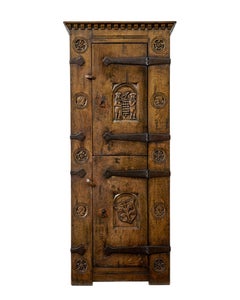 Mid century gothic revival carved oak hall cupboard