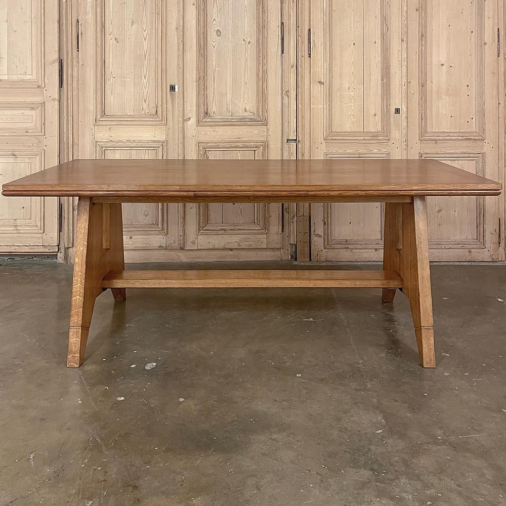 Mid-Century Grand Neogothic Rustic Draw Leaf Dining Table by DeCoene is ideal for a large space, a large family, and large parties!  Hand-crafted from solid oak and left in a natural finish, it is over six and a half feet closed, but extends to over