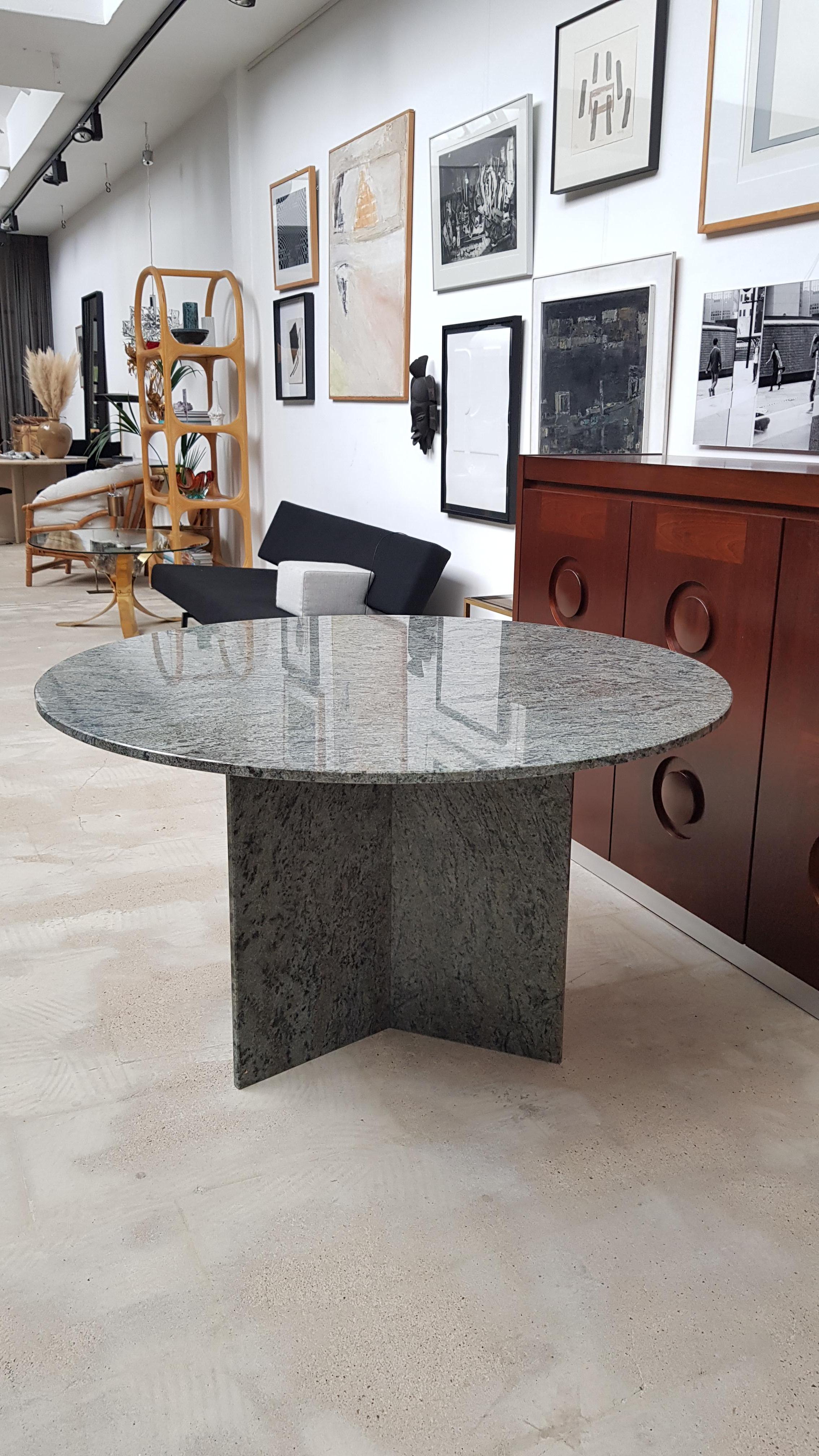 Large midcentury very contemporary dining table with a granite top and base. A mix of green and gray tones. Very good condition.