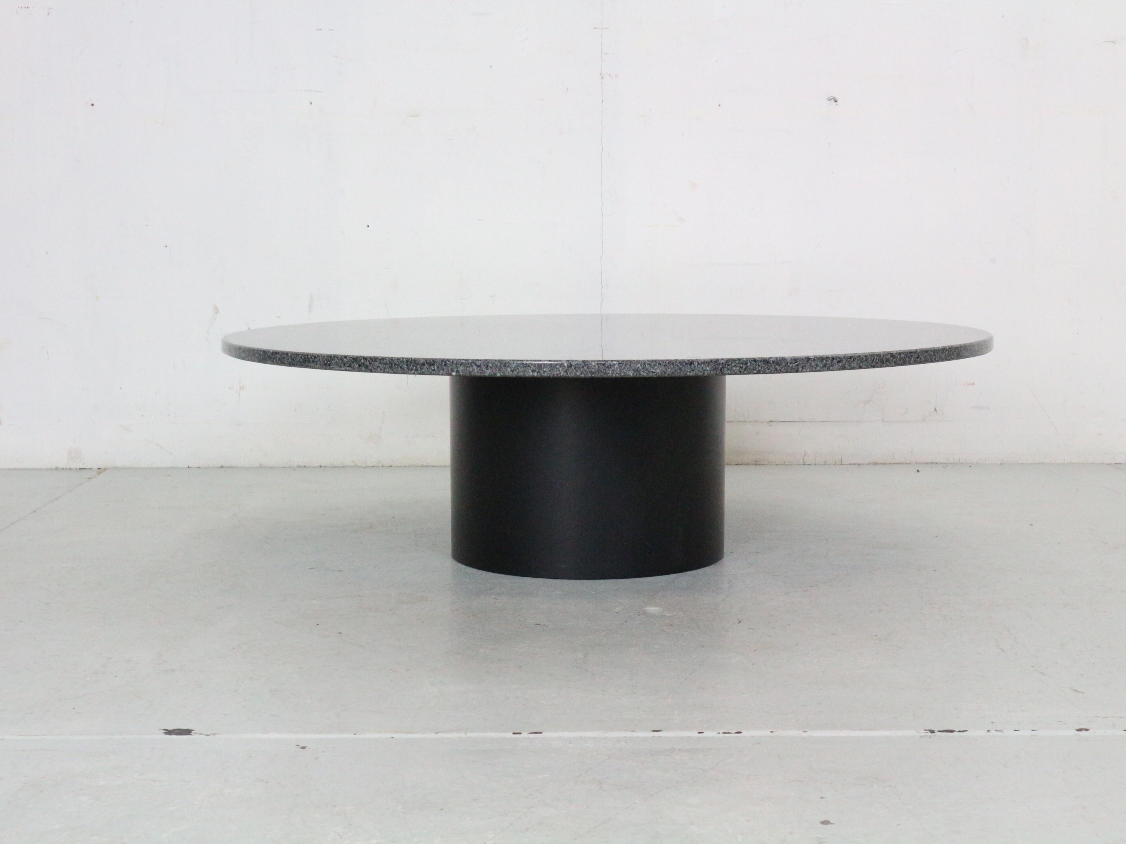 Mid- Century modern period coffee table manufactured around 1970's Italy.
The table top is made of grey/black granite stone and standing on a black solid steel round tube base.

Table is in great condition.
