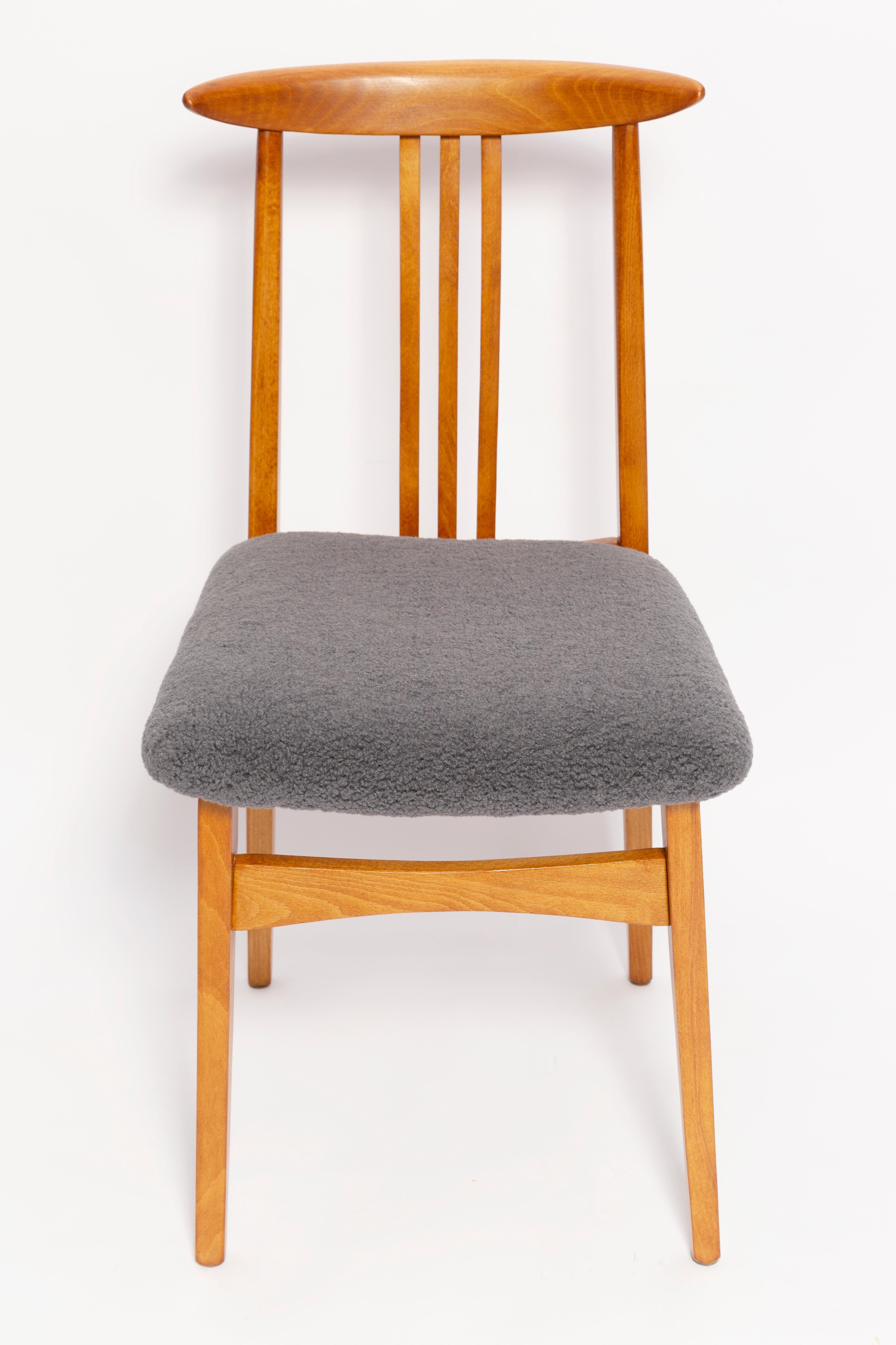 A beautiful beech chair designed by M. Zielinski, type 200 / 100B. Manufactured by the Opole Furniture Industry Center at the end of the 1960s in Poland. The chair is after undergone a complete carpentry and upholstery renovation. Seats covered with