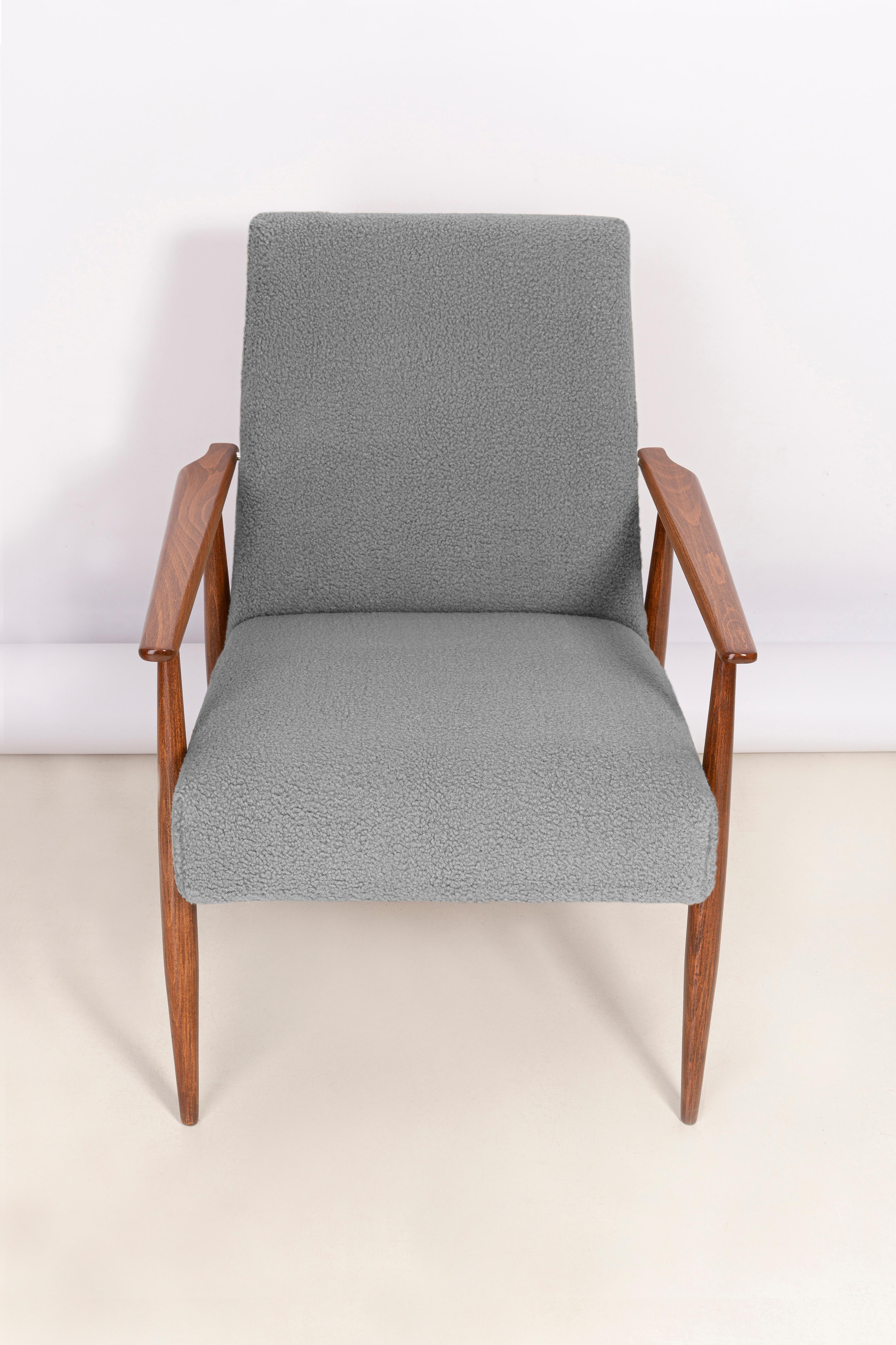 Beautiful mid century gray bouclé armchair, designed by Henryk Lis. Produced in Poland in 1960s. One of the best design from this time. Furniture after full professional carpentry and upholstery renovation. The armchair will be perfect in Minimalist