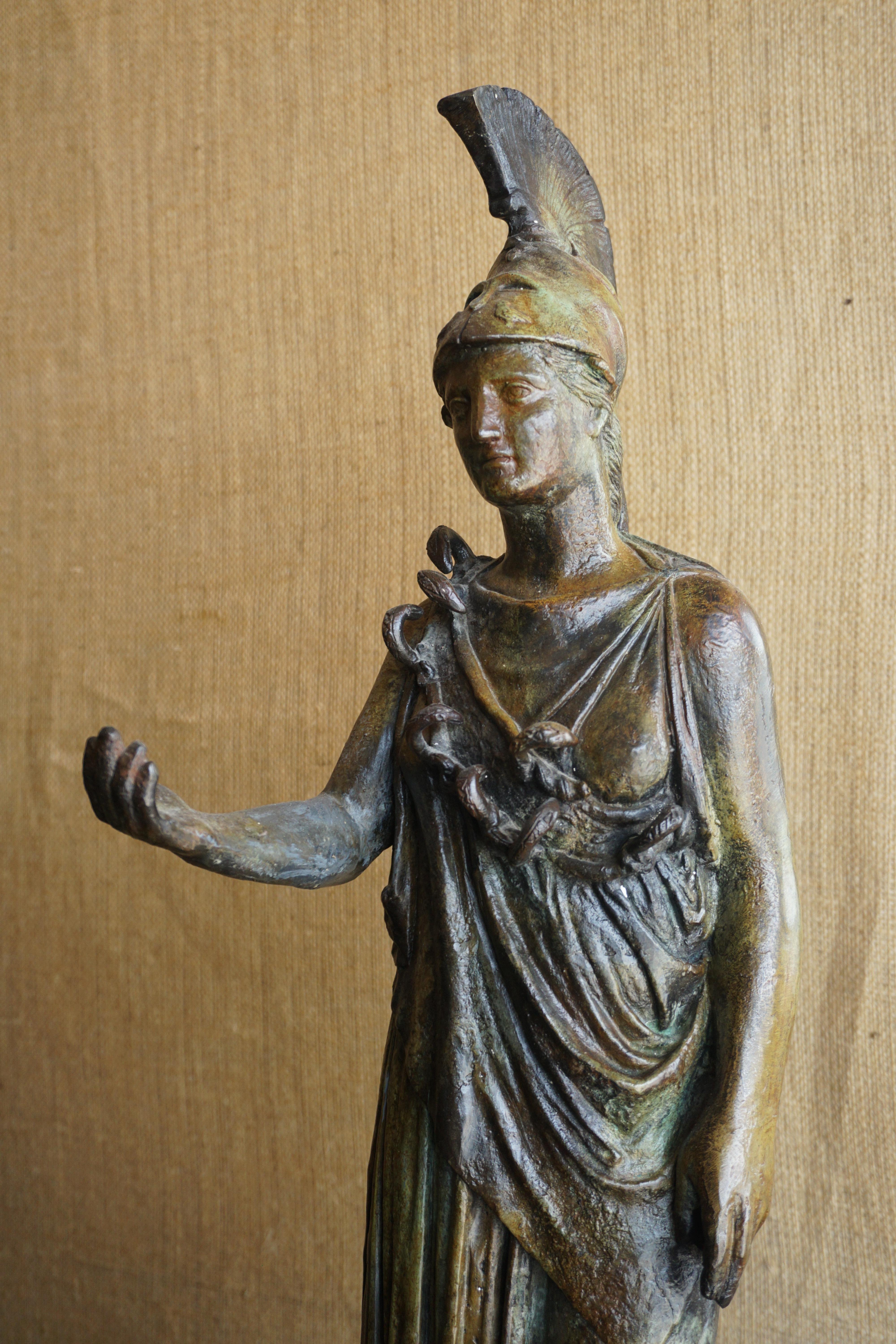 This bronze statue originates from Greece, midcentury.

Measures: 7.5'' W x 5.5'' D x 28'' H.