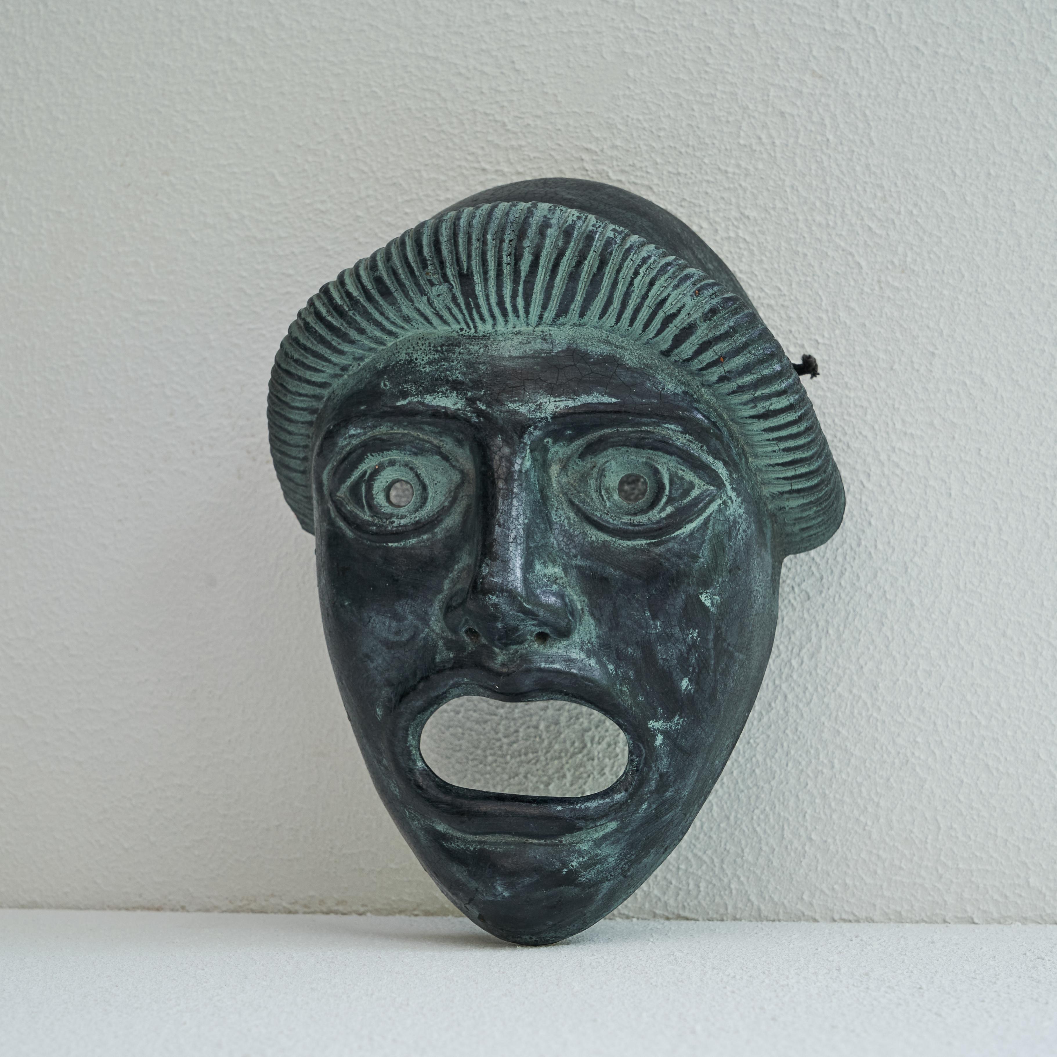 Mid-Century Decorative Mask. Greece, mid 20th century.

This is a beautiful ceramic decorative mask to display on your wall, made in Greece in the middle of the 20th century. Wonderful in shape and color and with a rich verdigris patination.