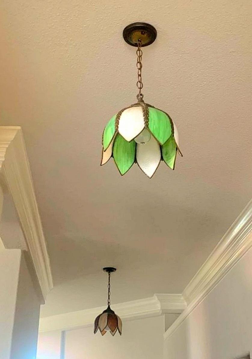 Beautiful green and white slag glass tulip pendant light.
Art Nouveau style
Brass hardware and trim.
Original chain is 19