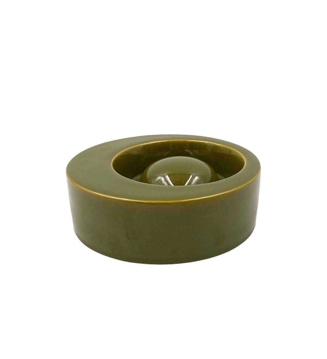 Midcentury green ceramic ashtray

Sicart 1969s Italy

H: 6 cm

Diam. 15.5 cm

Labeled on the base.

Conditions: excellent consistent with age and use.