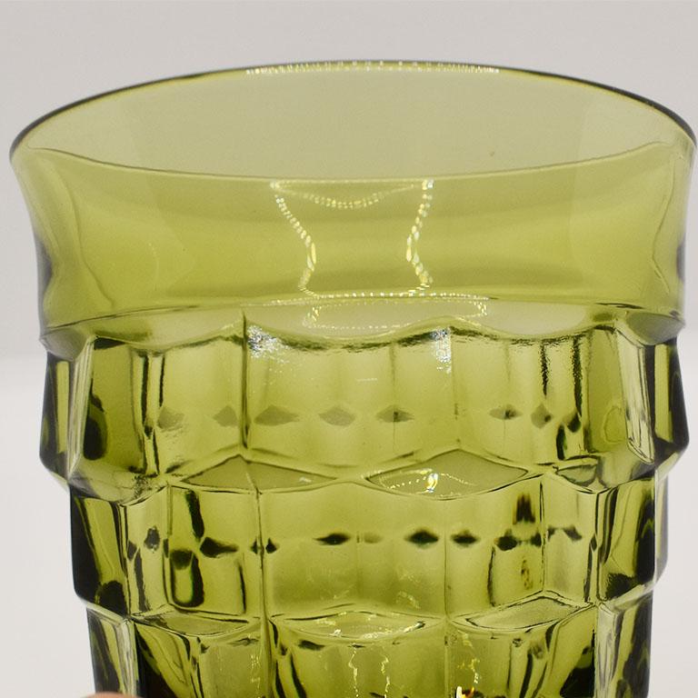 A set of green faceted drinking glasses. This set would be a great addition to any place setting. 

Measures: 3.5