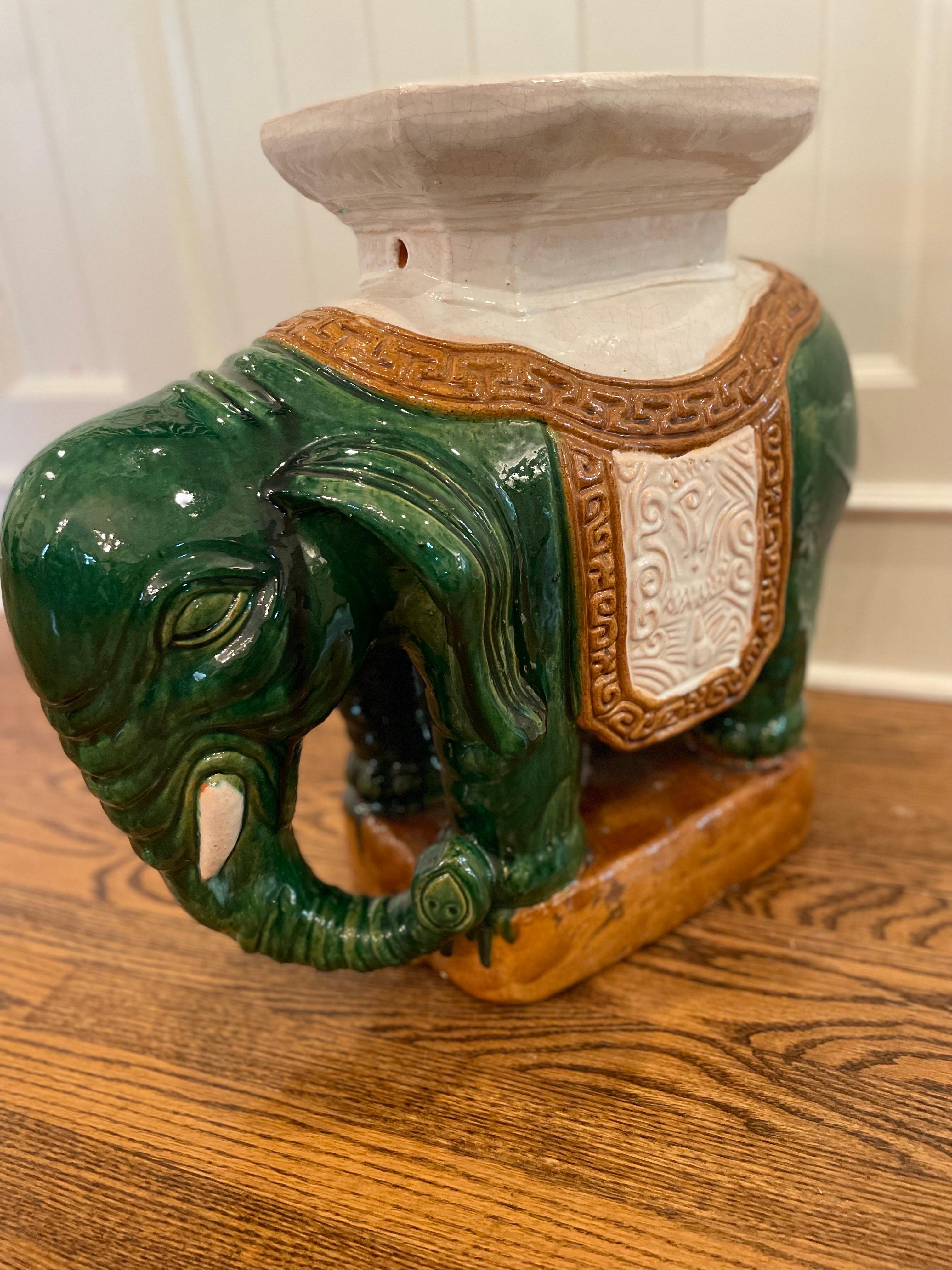An exceptional and very charming large garden stool, mid-20th century. Chinese glazed ceramic elephant form garden seat. Stamped with Makers Mark on inside- from Hong Kong. 

Sourced from the estate of a Kentucky Doctor with an exquisite perfectly