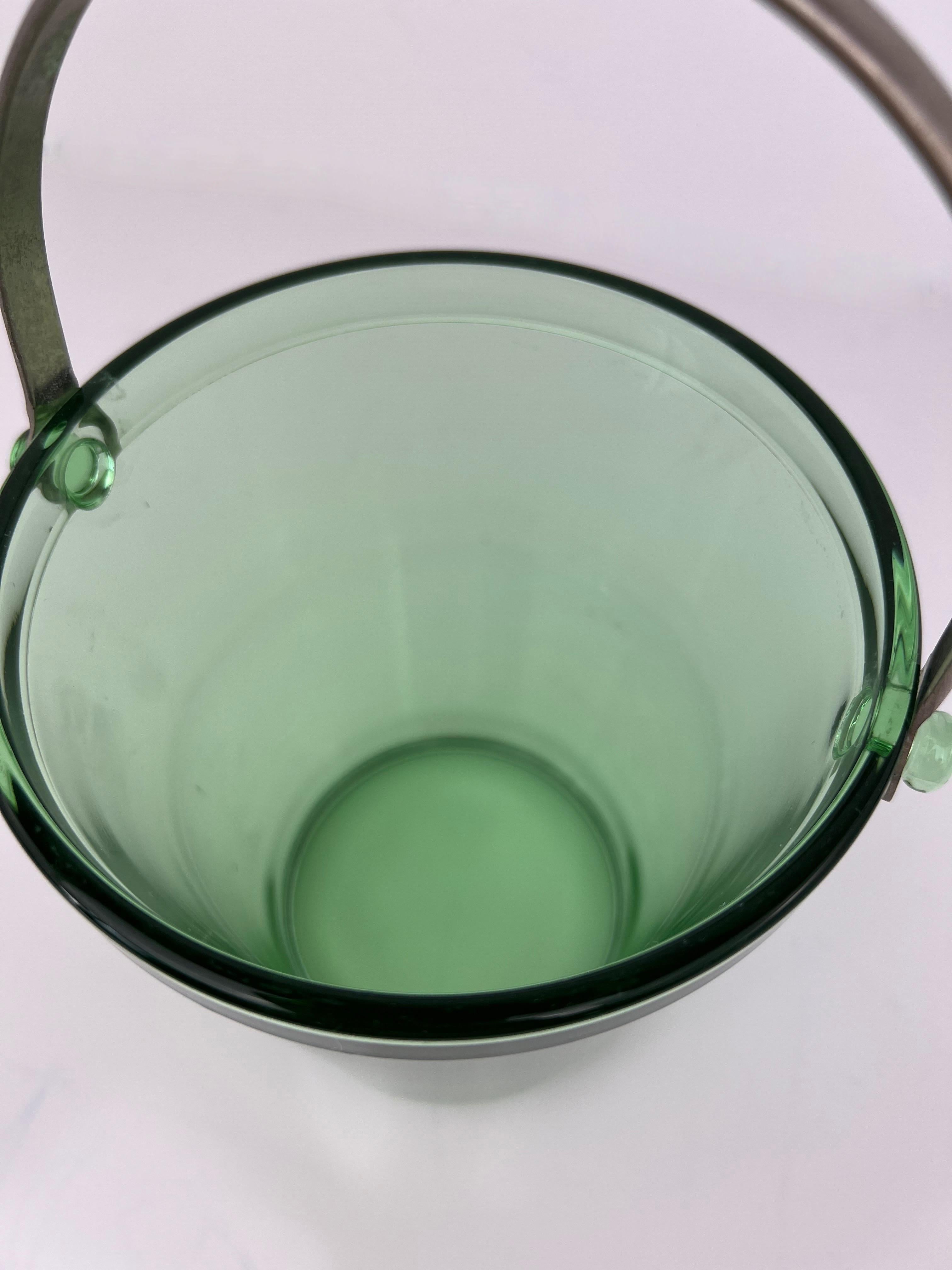 Mid Century Green Glass Ice Bucket with Stainless Handle. Petite size perfect for a bar cart.

5 15/16