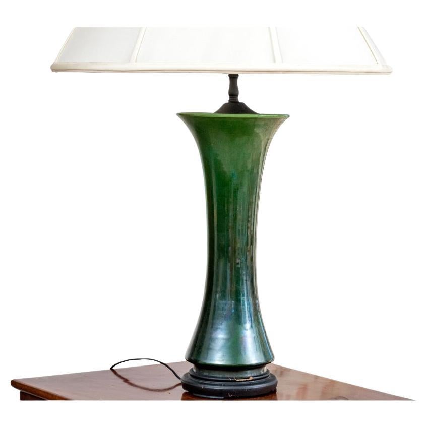 Refined Green glazed GU form vase mounted on an ebonized wood base with Ginko leaf form finial.

Dimensions: 32