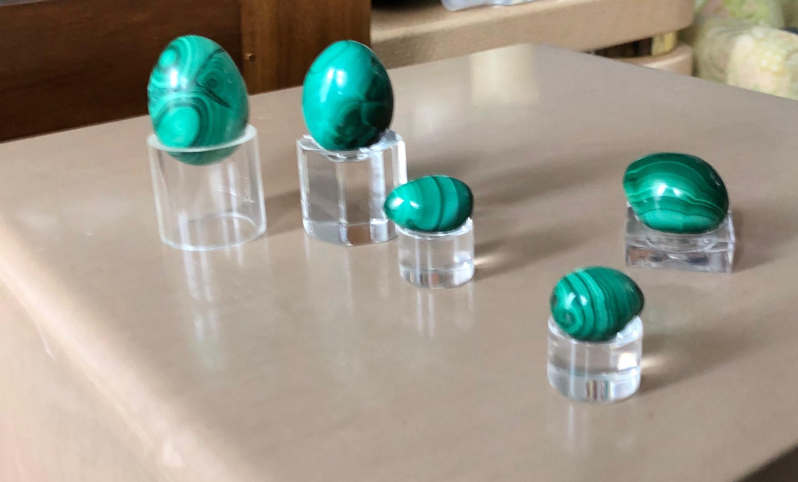 Midcentury green malachite hand-burnished egg set of five with Lucite bases.
Gorgeous hand burnished and carefully curated set of solid malachite eggs for your springtime pleasure. Don’t miss these gems!

  