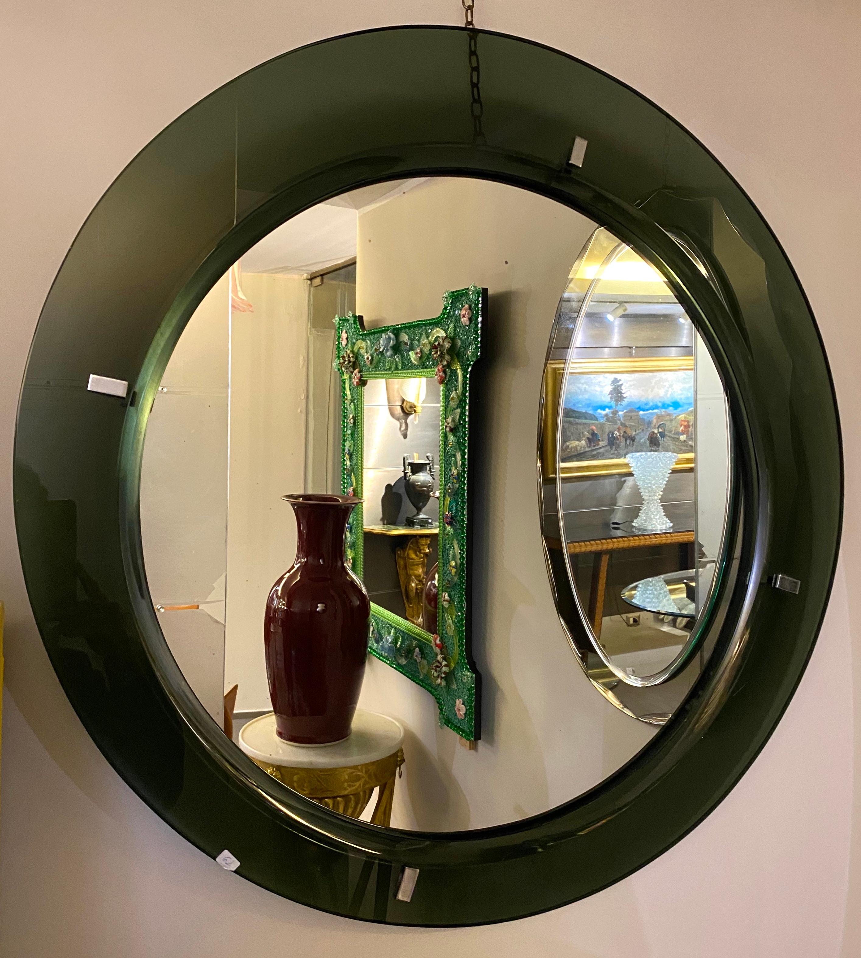 Beautiful mirror attributed to Max Ingrand for Fontana Arte. The mirror  green colored faceted glass framed with chrome support. Perfect vintage condition. 

