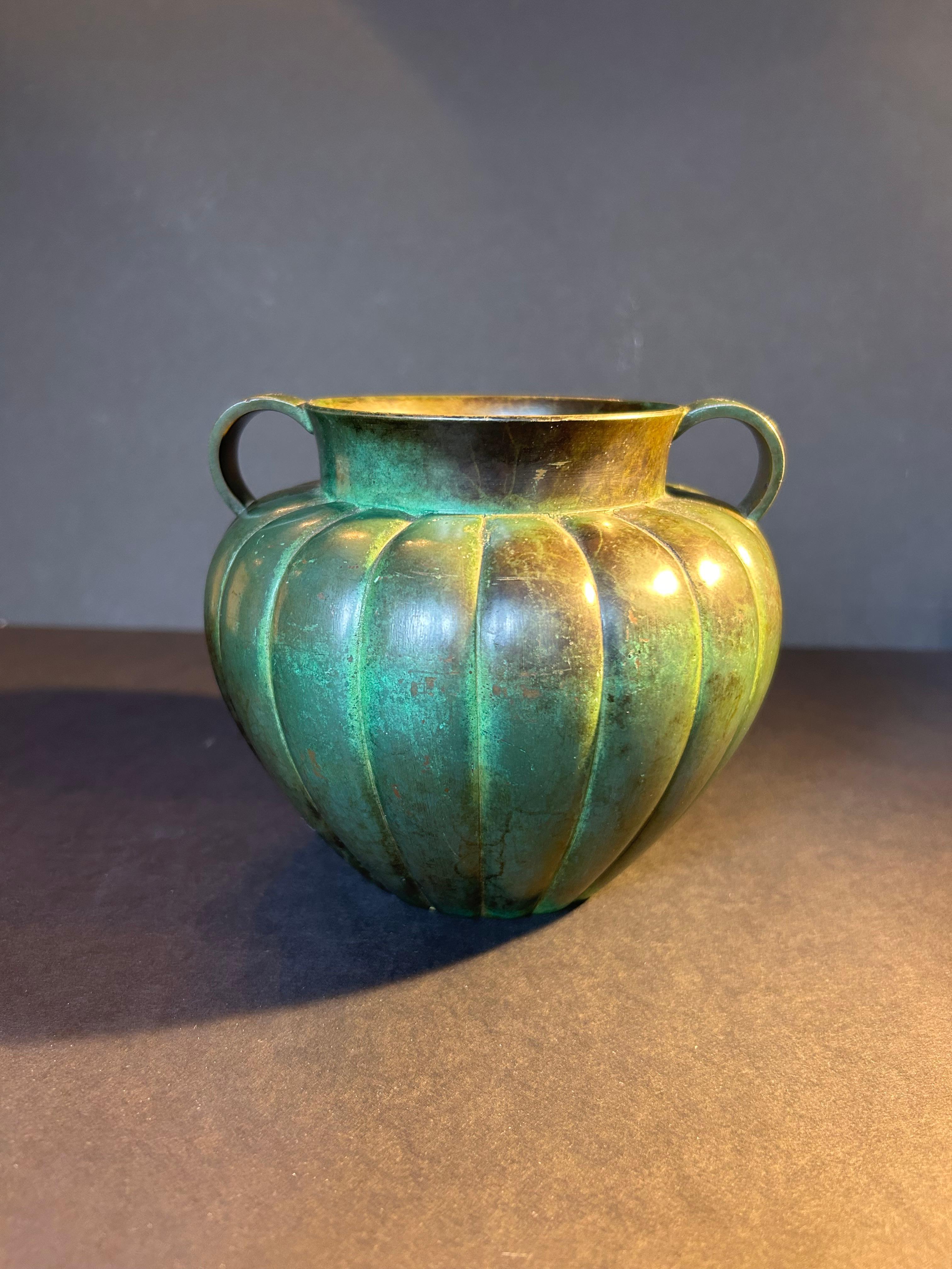 A fabulous, Swedish, gourd form, green patinated bronze vase,  by GAB Guldsmedsaktiebolaget , from the early to mid twentieth century.

This vase has a lobed body and is impressed with the maker's mark to the base. It has a gorgeous green patina