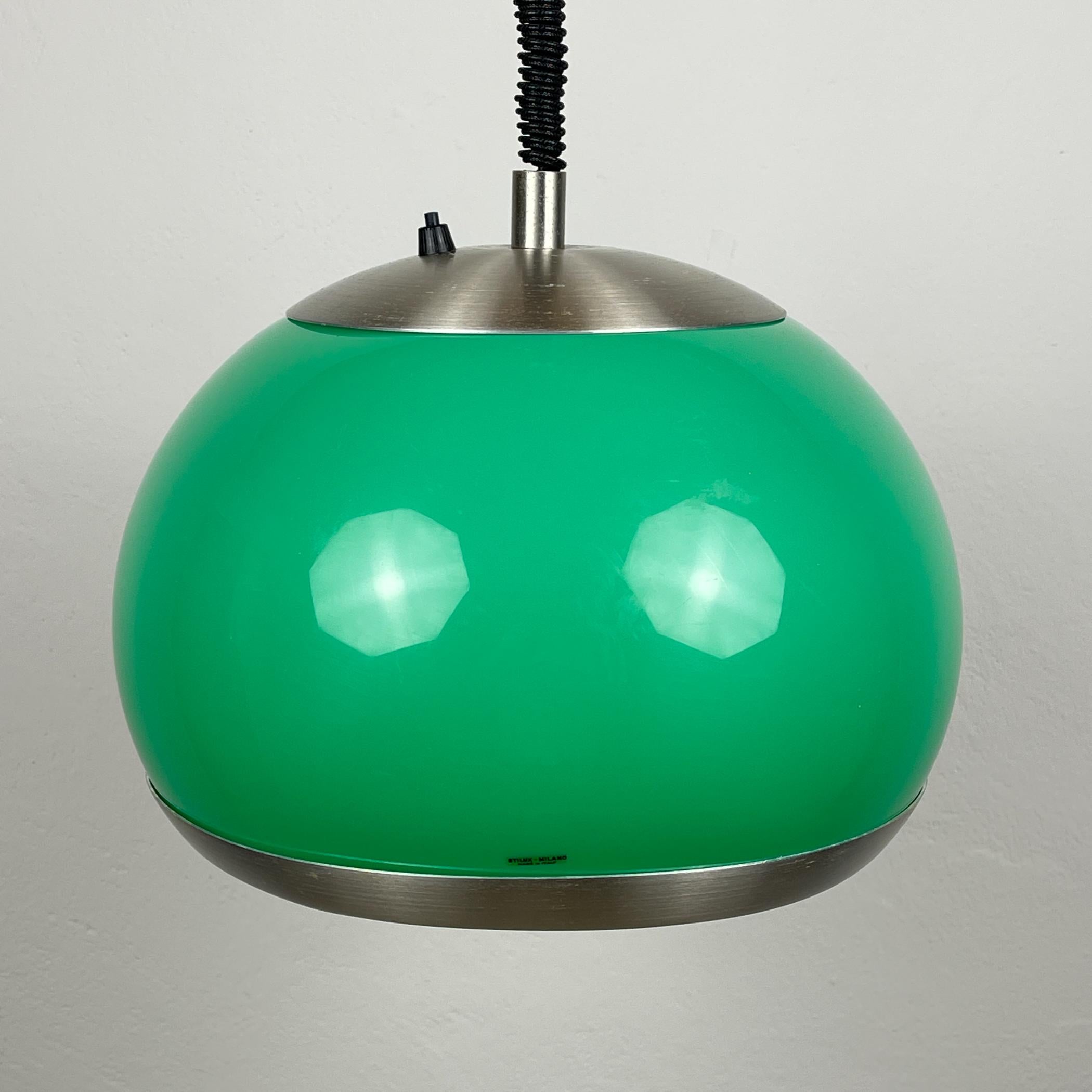 Mid-century green plastic pendant lamp by Stilux Milano made in Italy in the 1972.
Stilux Milano was an Italian lighting company that was founded in Milan in 1946. The company was known for its high-quality and innovative lighting designs, which