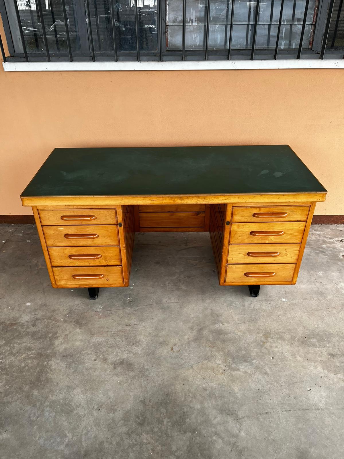 Mid-century green top and eight drawers wooden desk by Anonima Castelli
A wooden desk with eight drawers and green top.
This desk has been restored in conservative way.
Size: D 70 x W 160 H 78 cm

A video is available upon request.
 

 