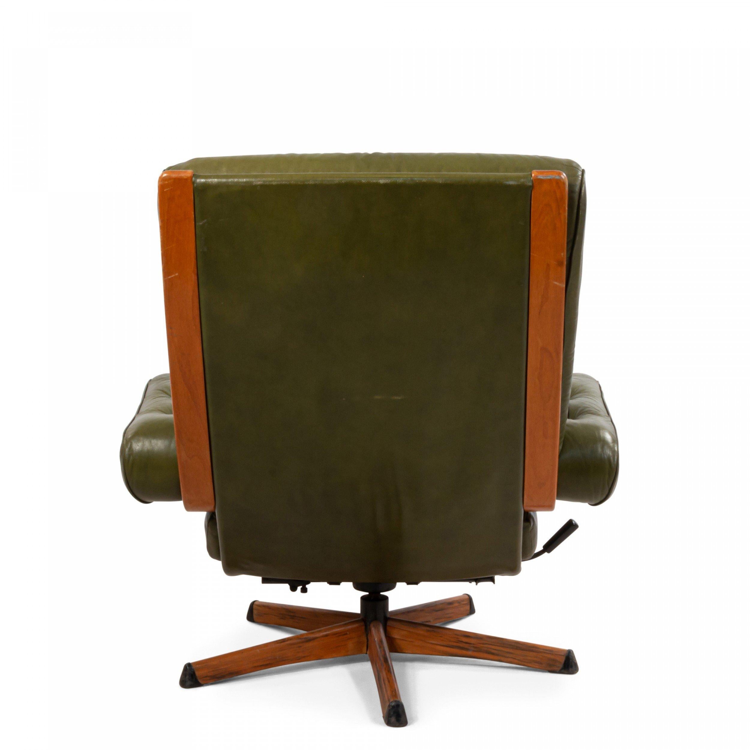 Mid-century green tufted leather armchair with wooden detail on a five-legged swivel base.