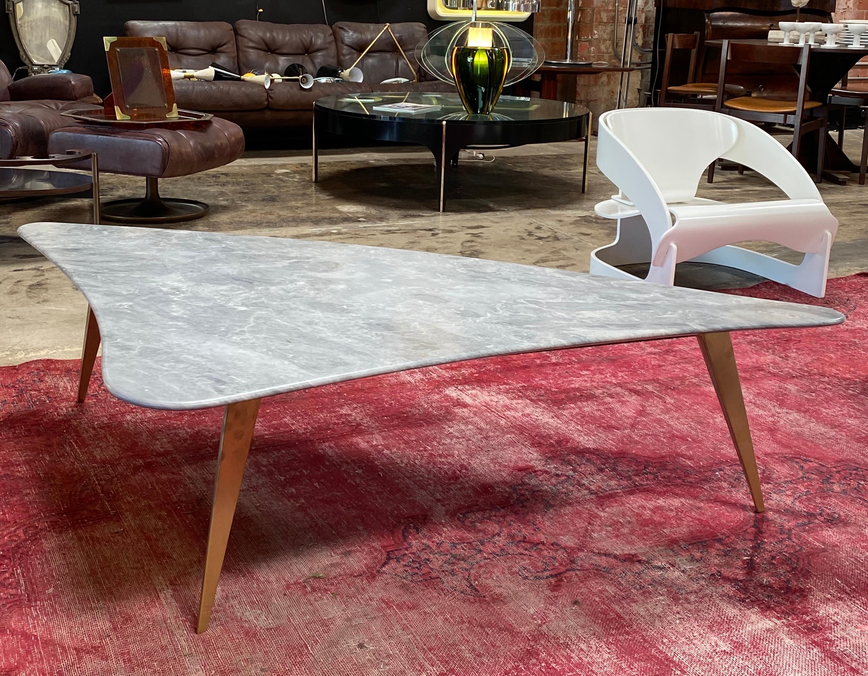 Midcentury grey marble and brass coffee table, Italy, 1960s
Beautiful coffee table with gorgeous grey marble top in organic form and brass legs with brass made in Italy, during the 1960s.
The grey marble has a beautiful natural marble design with