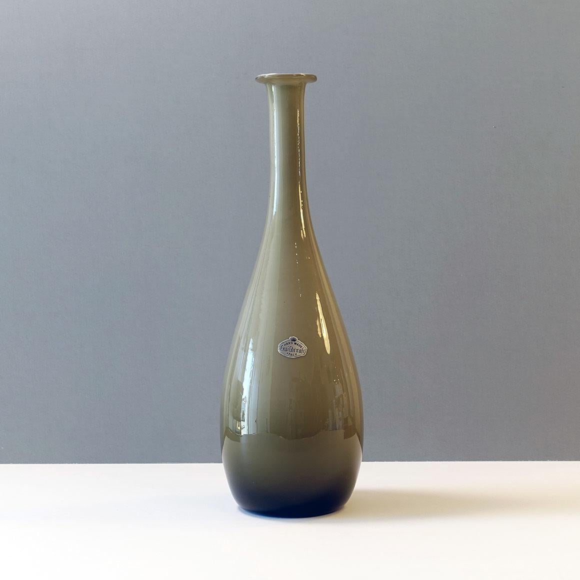 Guildcraft imported fine collectible mouth-blown, hand-finished cased art glass from Empoli, Italy. This beauty has a gray exterior and an internal layer of opaque light gray “Lattimo” glass. Stunning. A flat turned out lip and a full bulb shape to