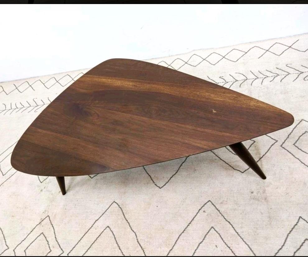 Guitar pick walnut coffee / cocktail table. There are two available as they could make a great pair of end tables of night stands, Triangular form top with beveled edge and 3 elegant tapered legs. Underside with Phillip Powell style support