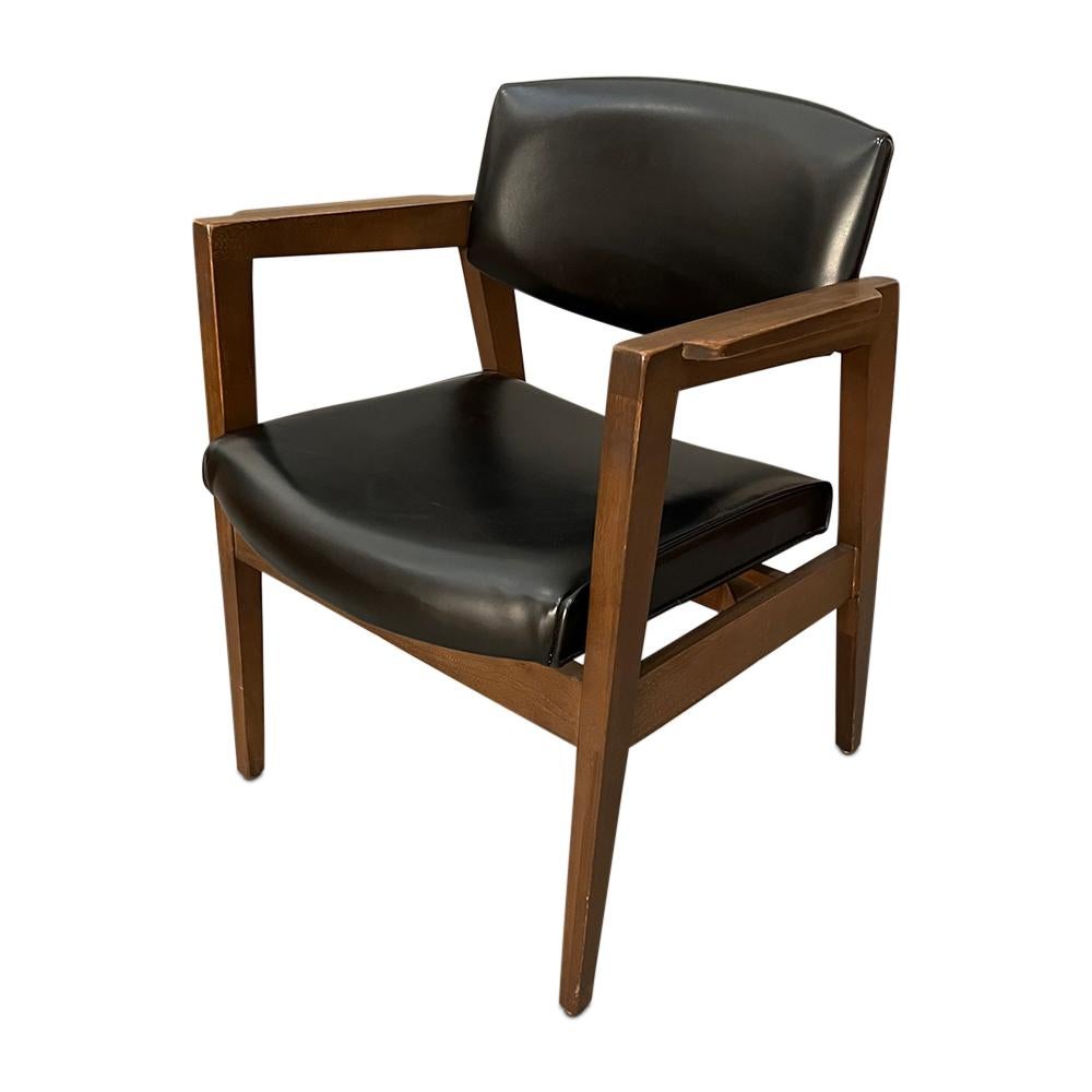 Mid-Century gunlock office dining arm chair with black leather 1960s
Dimensions: arm to arm: W24” inches 
Exterior Deep: 24” inches 
Back Height: 30.5” inches 
Arm height: 26.5” inches 
Seat height: 18” inches
