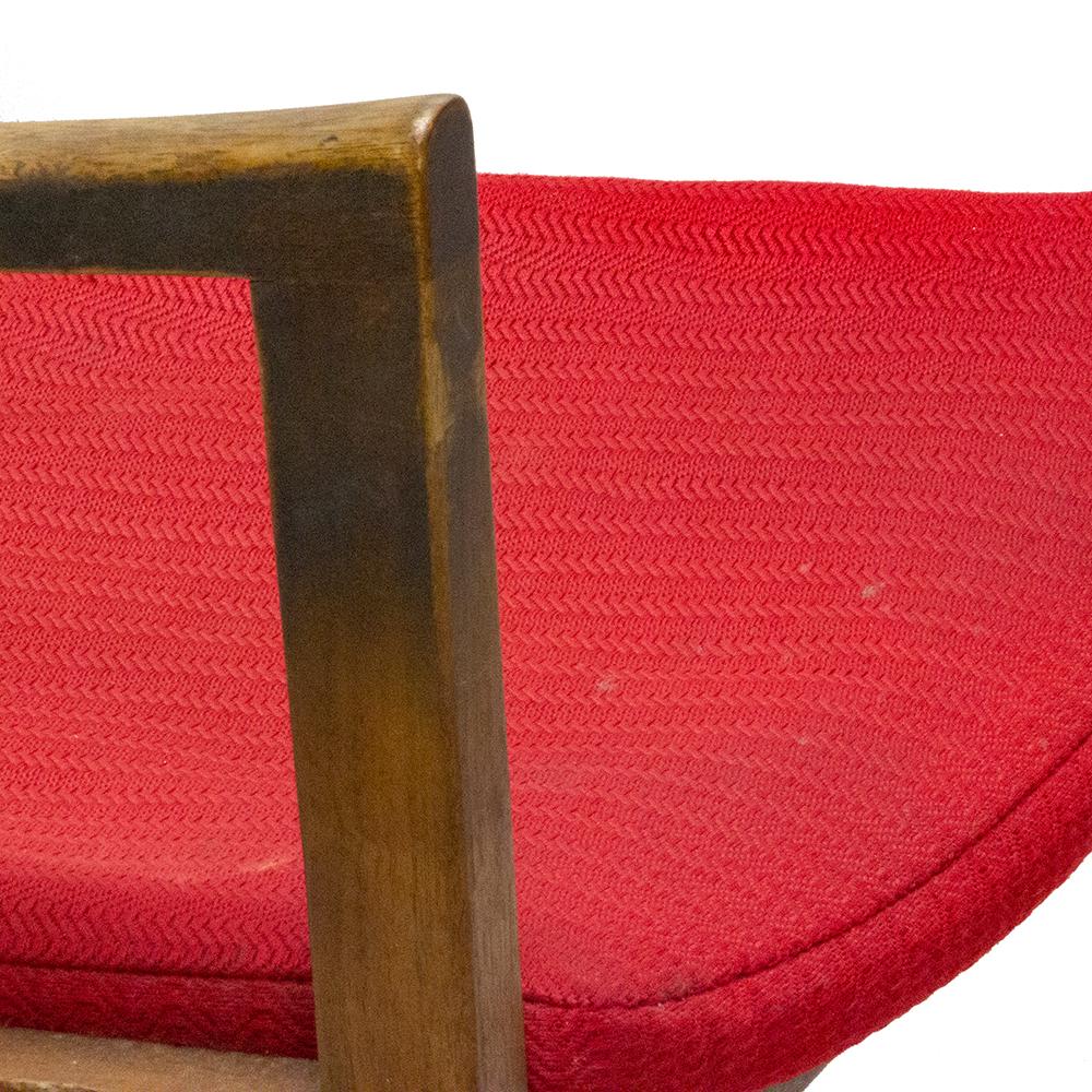 Bright red upholstery and a dashing silhouette make these Gunlocke chairs proven winners. The solid walnut frames and upholstery are in good condition and came from an east coast law school.

Arm height clearance 26.5