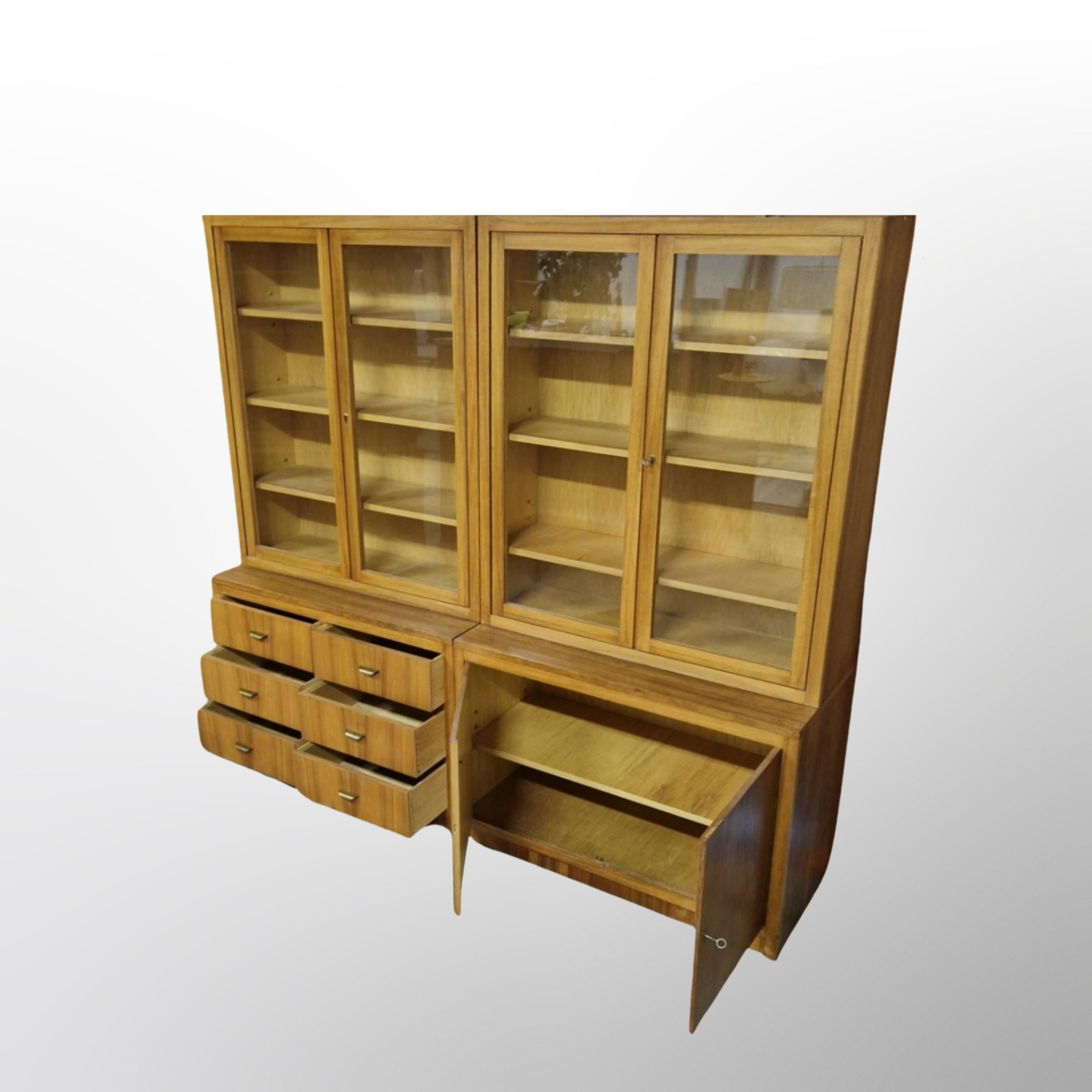 Mid century haberdashery high boards. Made from solid wood and teak veneer. 2 different models. One with drawers and one with doors. We have 2 of each model available. Quality made pieces that were custom made for the first owner by a skilled