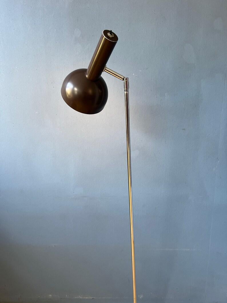 Unique mid century floor lamp with rotating pole. The ball mechanism in the base allows you to rotate the pole 360 degrees. The lamp can be switched on and off on top of the shade. The base is particularly heavy, this allows the pole to be