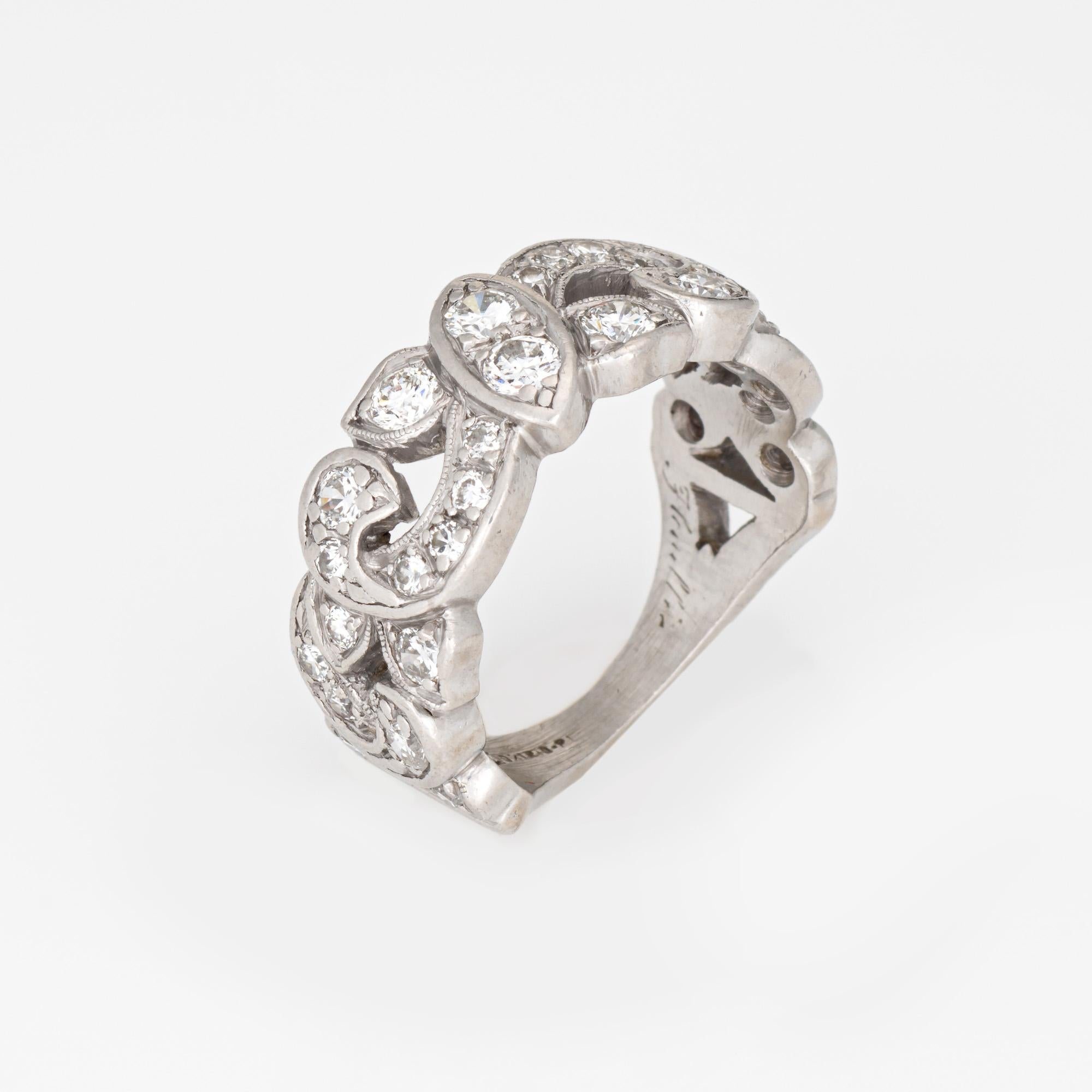 Finely detailed vintage diamond band crafted in 900 platinum (circa 1950s). 

30 full cut diamonds total an estimated 0.50 carats (estimated at H-I color and VS2-SI2 clarity). 

Shimmering diamonds are set into the half scrolled band. The wider band