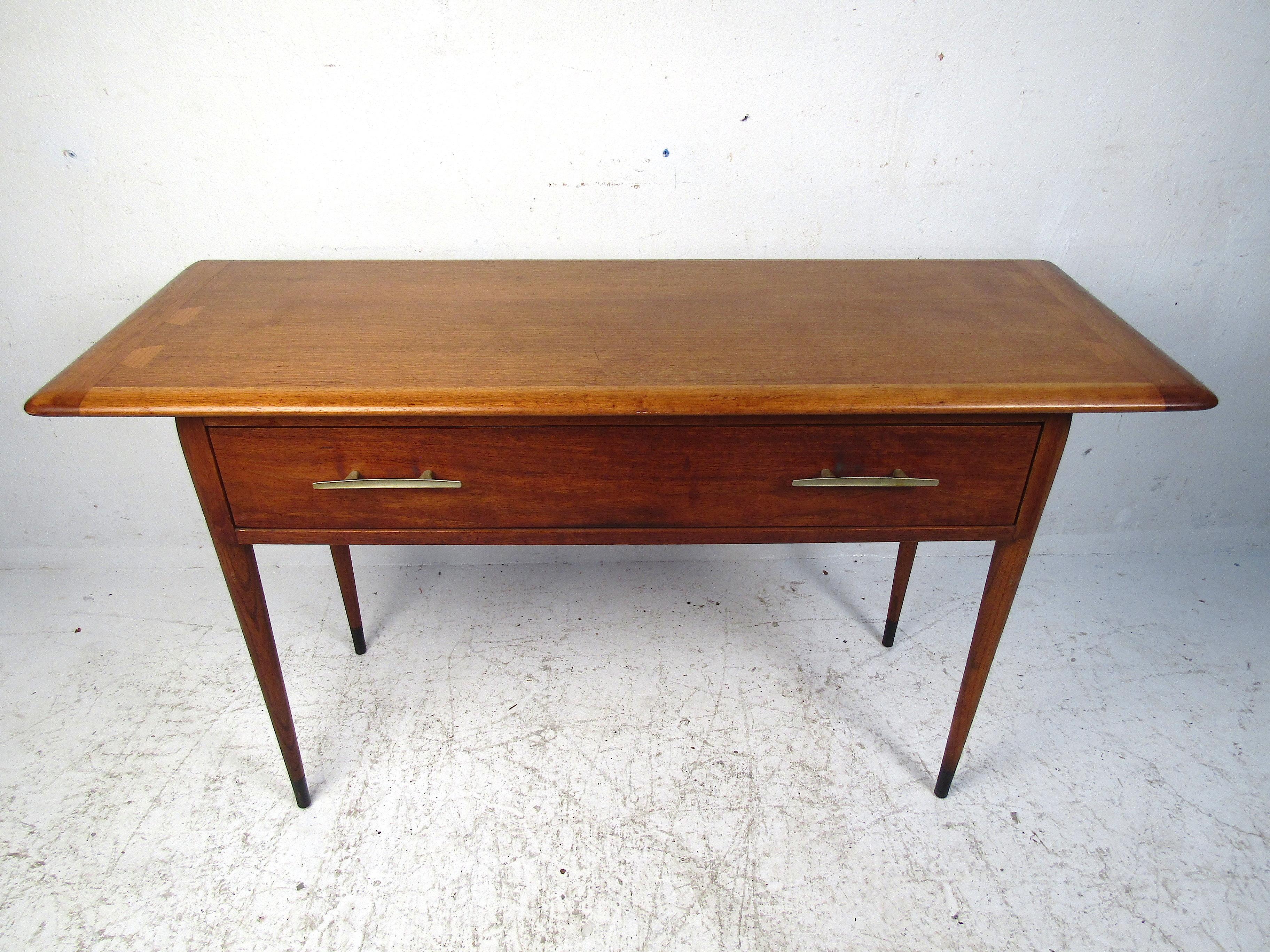 Stylish midcentury console table manufactured by Lane Furniture Co. Good-looking table with tapered legs, half-bowtie inlays on the edges of the tabletop, and dovetail jointed drawers. Please confirm item location with dealer (NJ or NY).