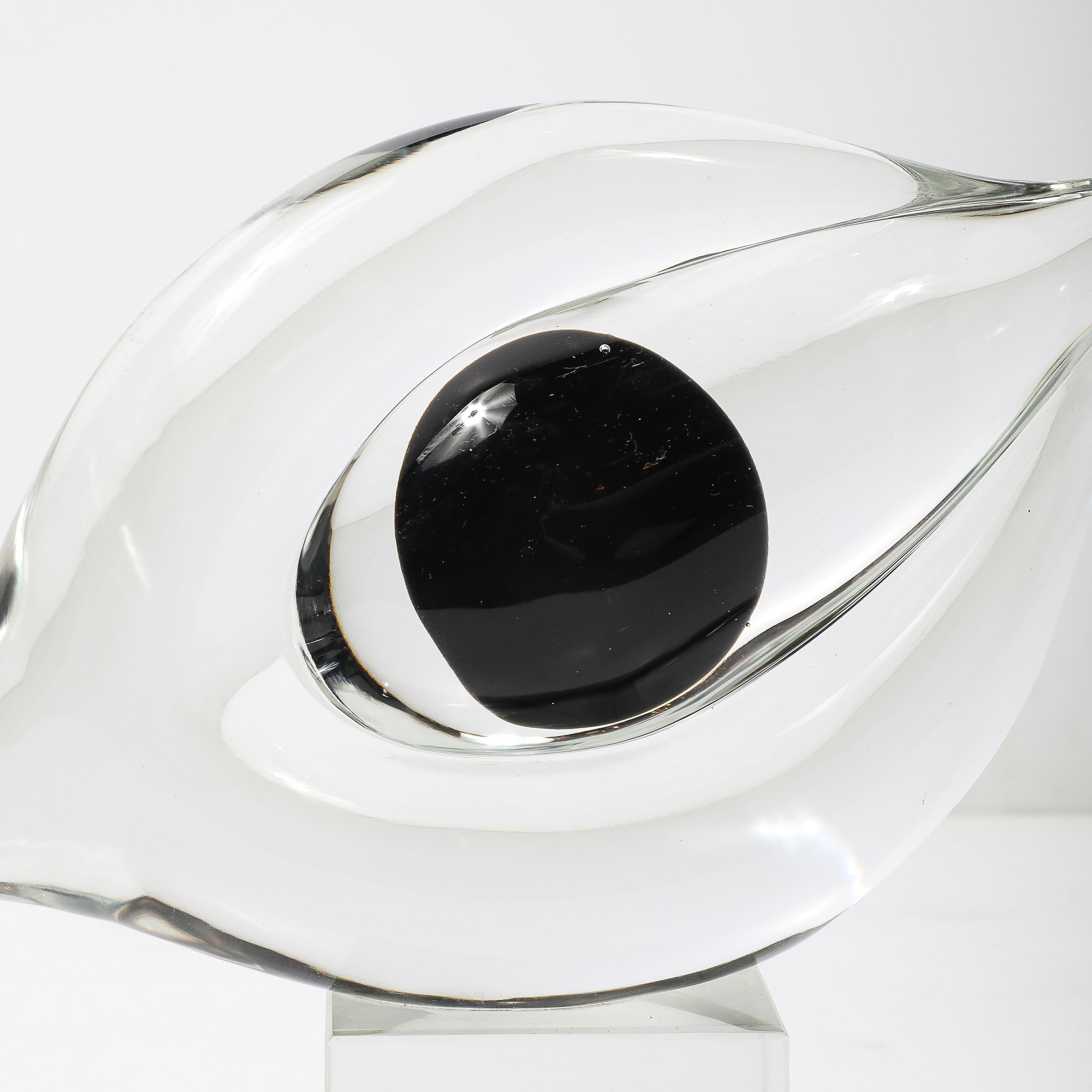This elegant mid-century modernist abstract sculpture by renowned Italian glassmaker Seguso is a masterful work of hand-blown Murano glass design. Dating to circa 1960, the abstract form is thoughtfully composed of clear and black glass, achieving a