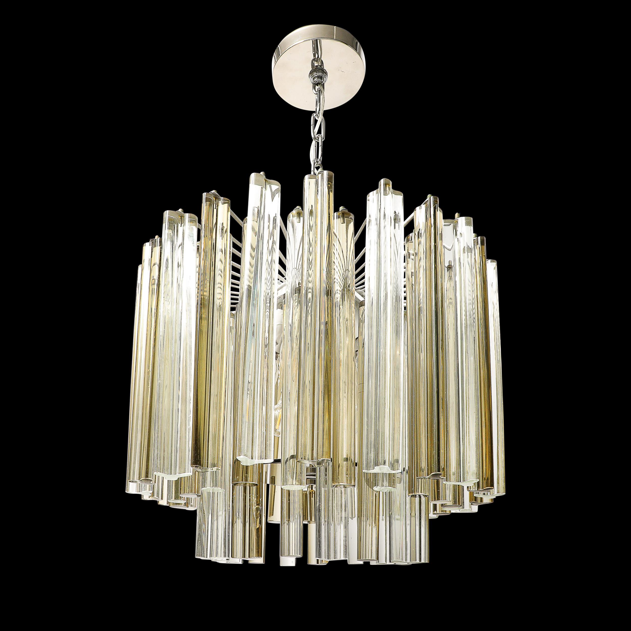 This well composed and sleek Mid-Century Modernist Hand-Blown Murano Glass Three Tier Stepped Triedre Chandelier in Transparent and Muted Olive by Venini originates from Italy, Circa 1970. Features three tiers of glass, the outermost of Triedre