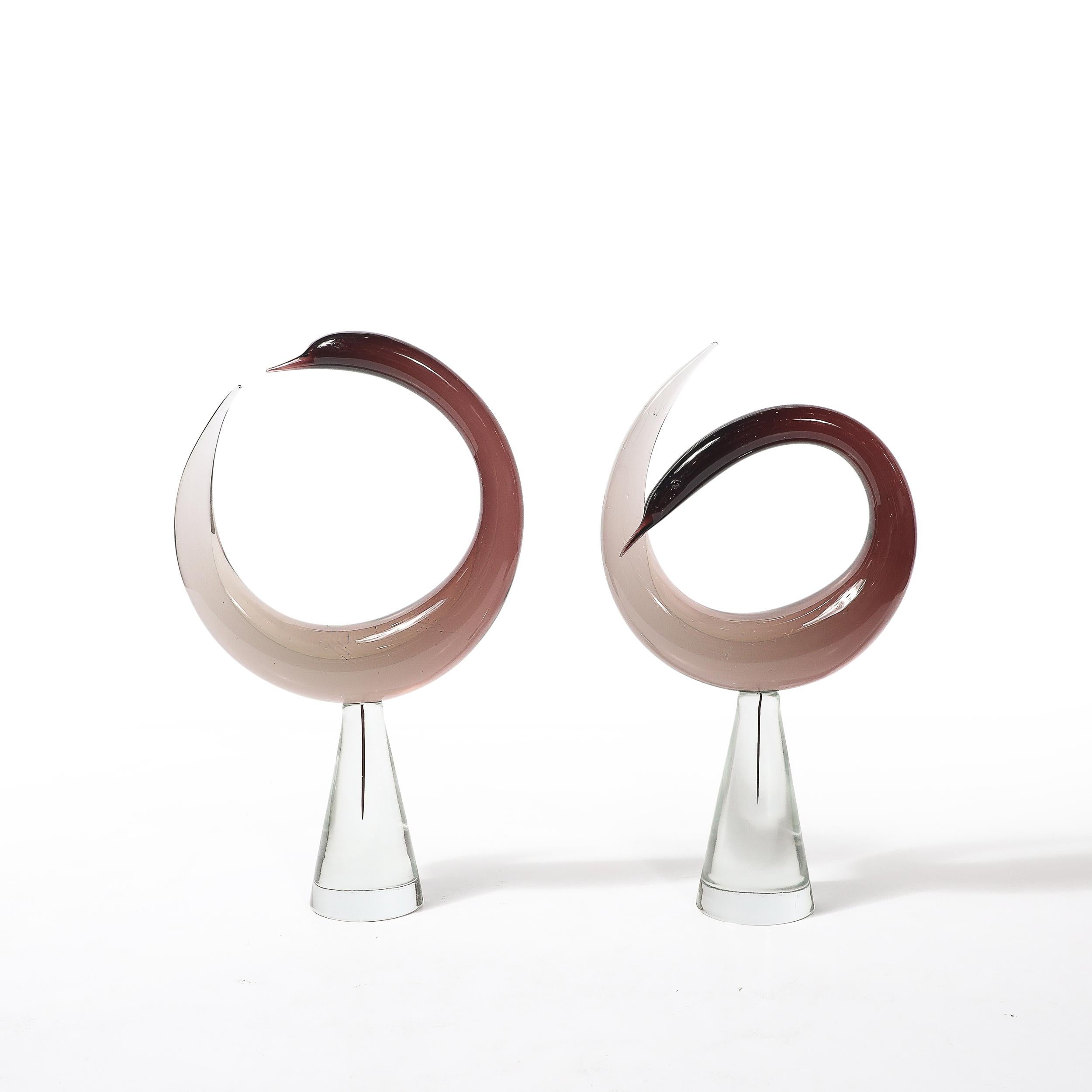 This remarkable pair of mid-century modernist Murano glass bird sculptures represents the enduring artistry of Luciano Gaspari, one of Italy's most renowned 20th-century designers, created for the esteemed glass manufacturer Salviati. Dating to