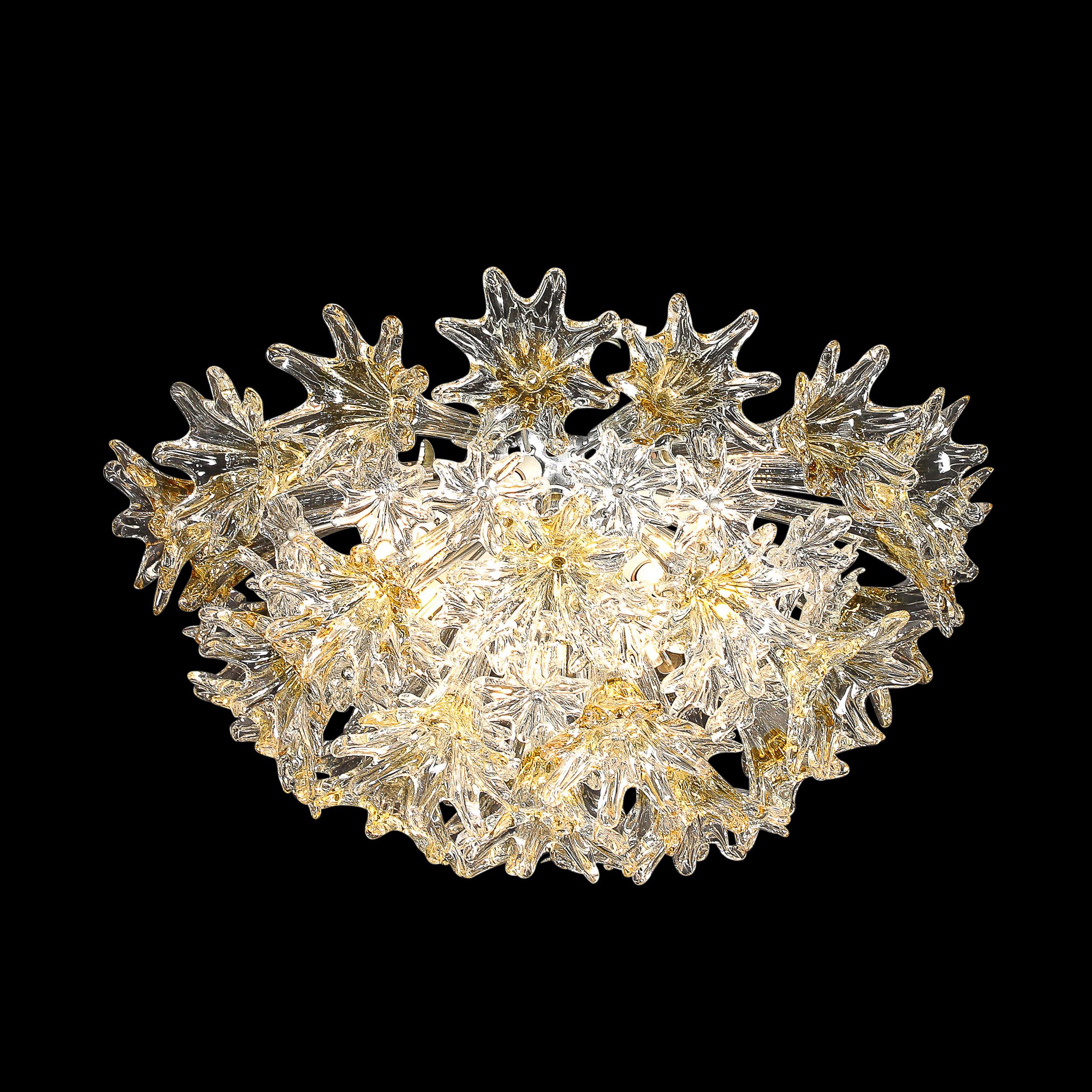 This elegant a stunningly achieved Mid Century Modernist Hand-blown Murano Stylized Floral Translucent & Amber Flush Mount Chandelier is by Venini and originates from Italy, Circa 1970. Features a half spherical flush mount composition featuring an