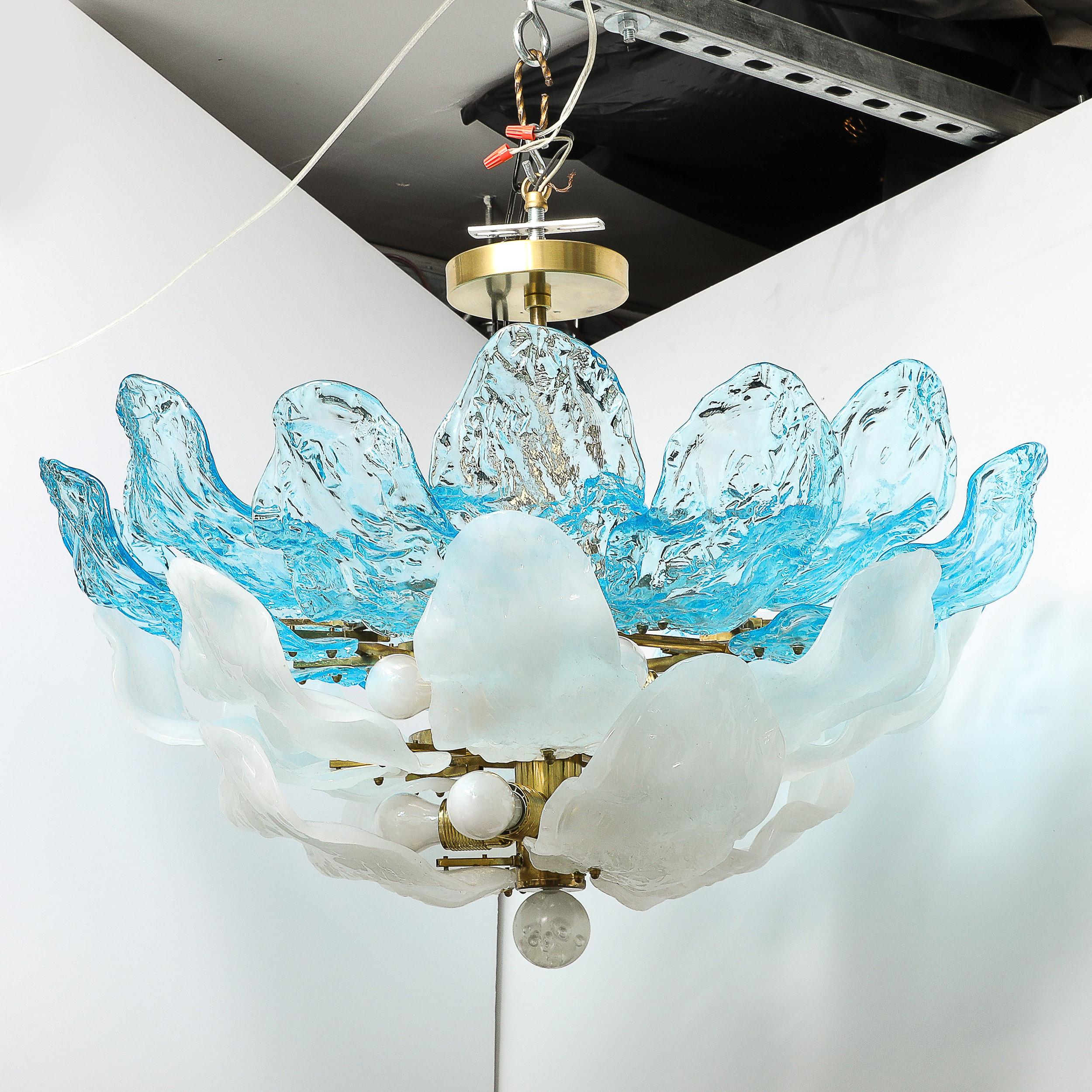 This gorgeous and impactful Mid-Century Modernist Hand-Blown Two-Tier Murano Glass Petal Chandelier in Cerulean Blue and White W/ Orbital Drop originates from Italy, Circa 1960. Formed in a multiplicity of petal form shades rendered in stunning hues
