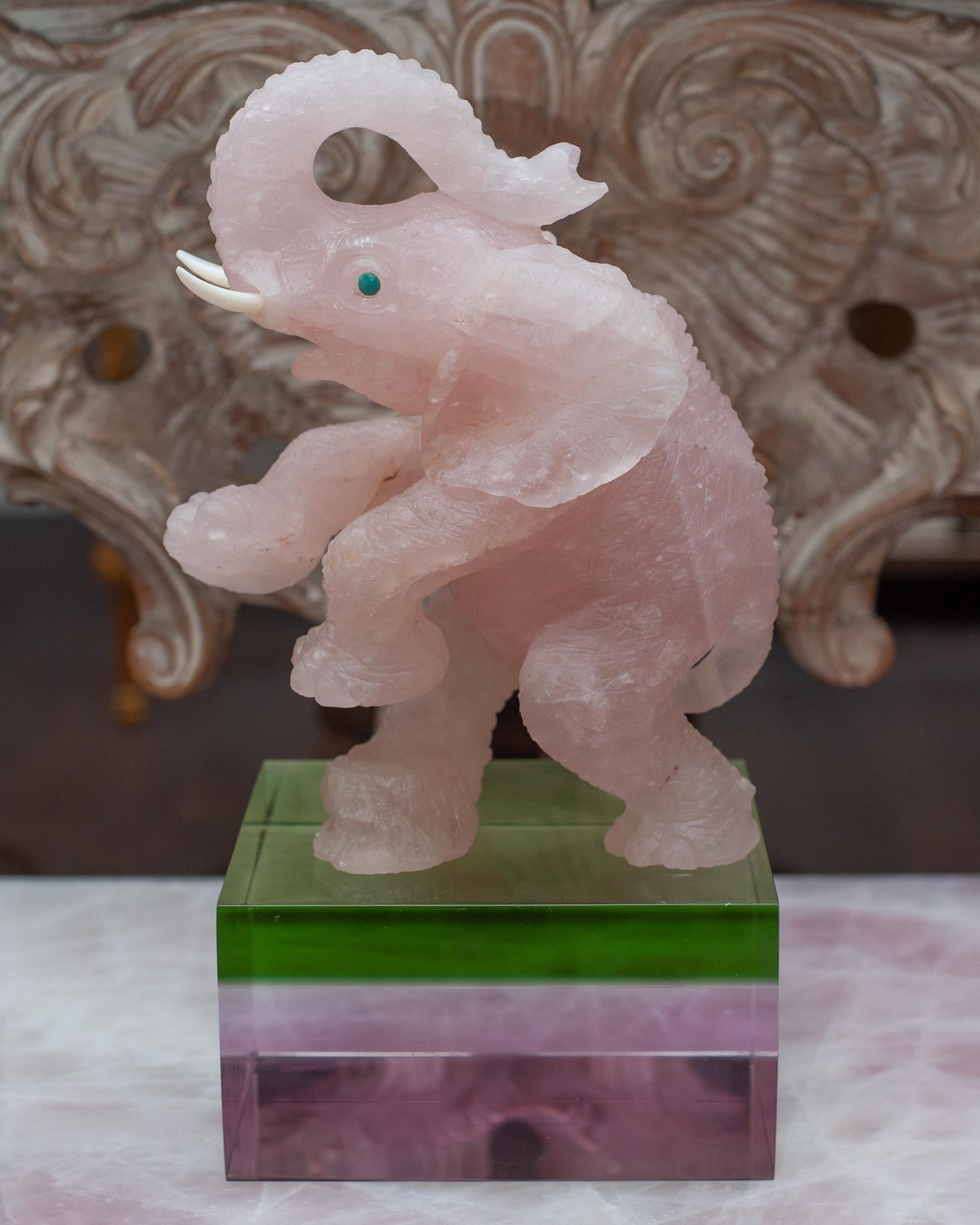 A stunning and highly detailed rose quartz elephant carving with turquoise cabochon eyes. Masterful in its detail and quality of carving. Elephants are considered a symbol of good luck, power and wisdom; place in the entrance of your home to welcome