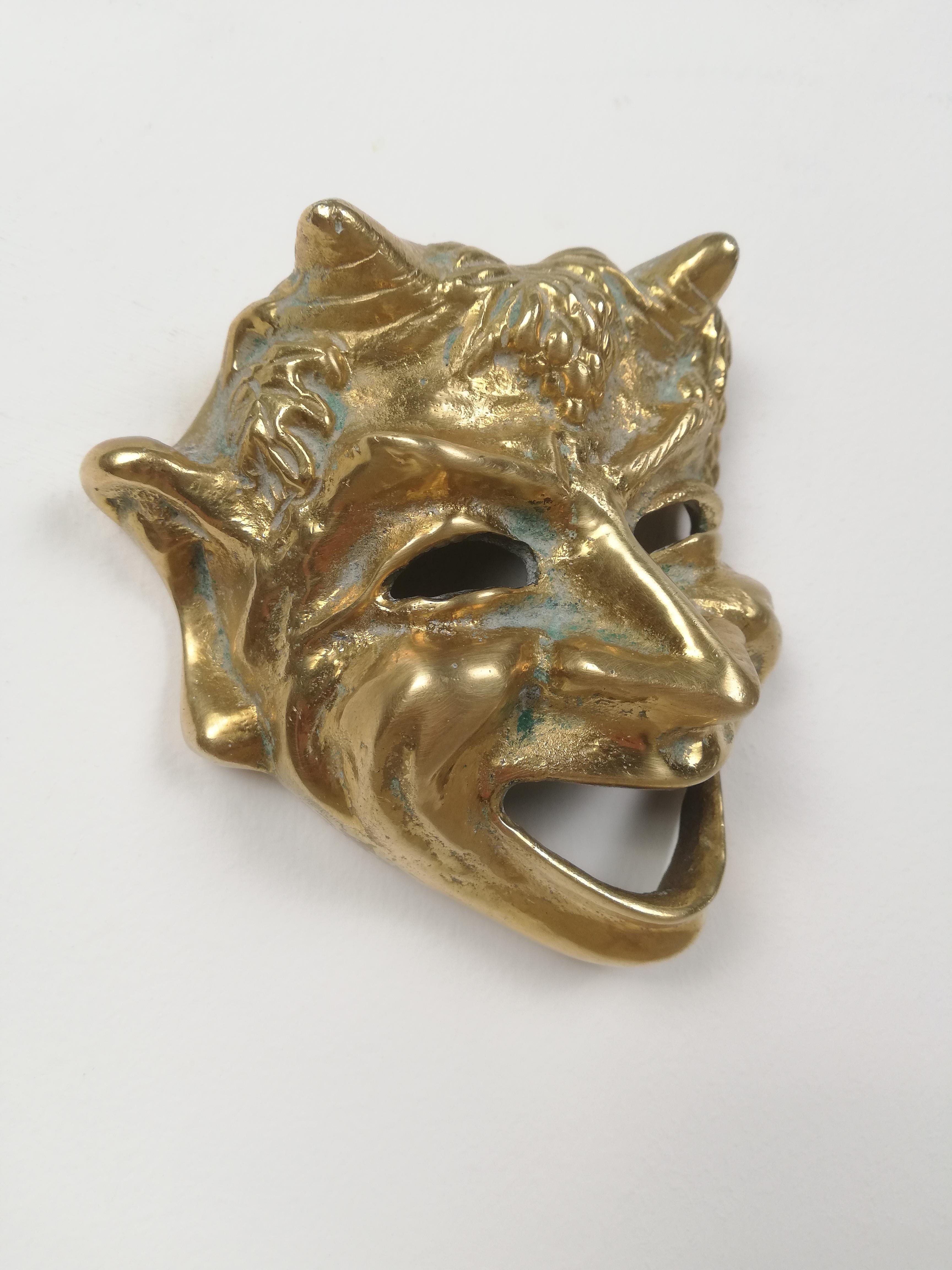 A couple of vintage masks inspired by the Greek Roman theater.
They were made in solid brass and represent respectively the 2 most important theatrical genres: comedy and tragedy.
Comedy is represented by a laughing satyr while tragedy, by a