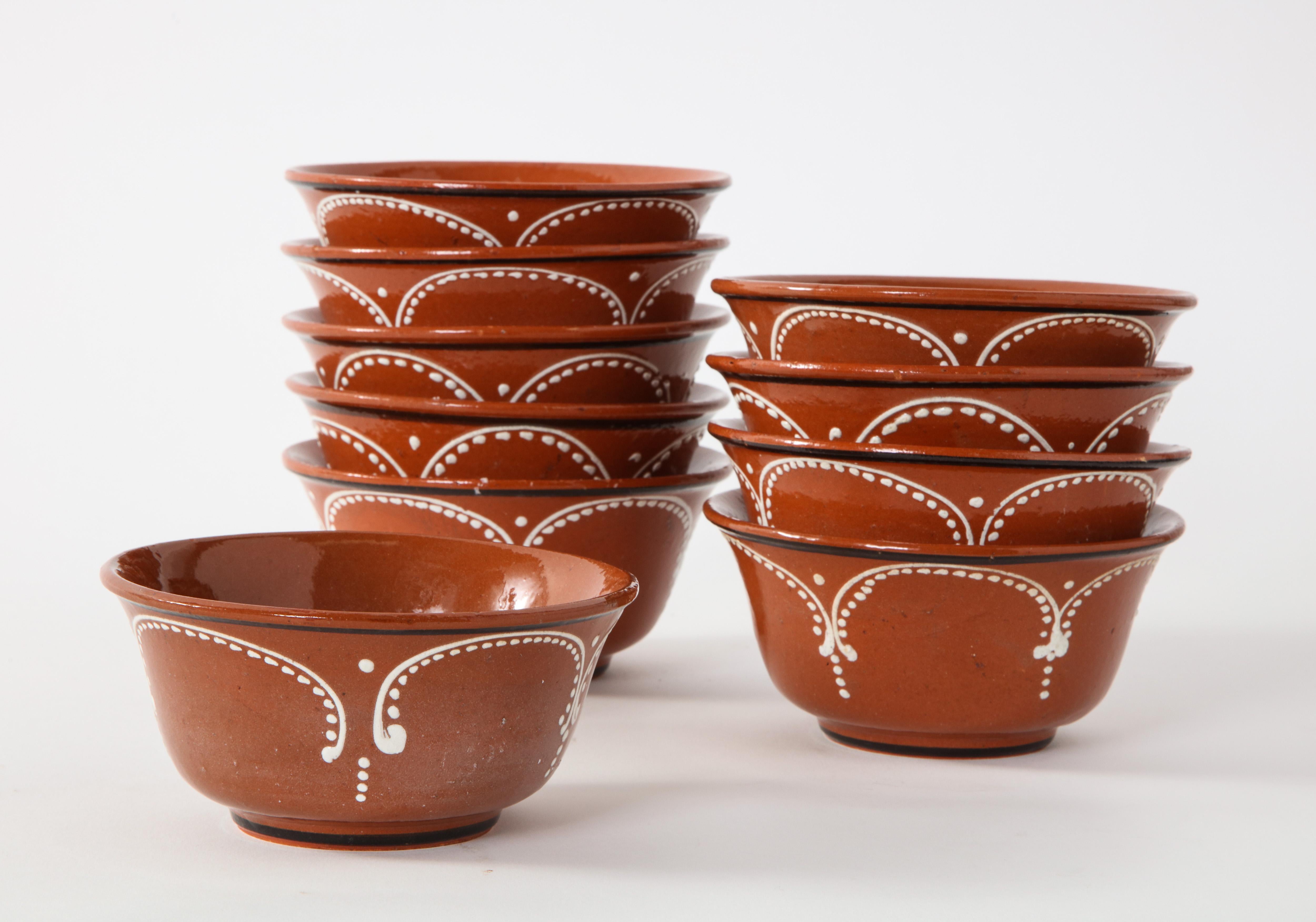 Set of 10 Mexican Tlaquepaque terracotta bowls, hand glazed, circa 1950. Food safe, hand wash only.