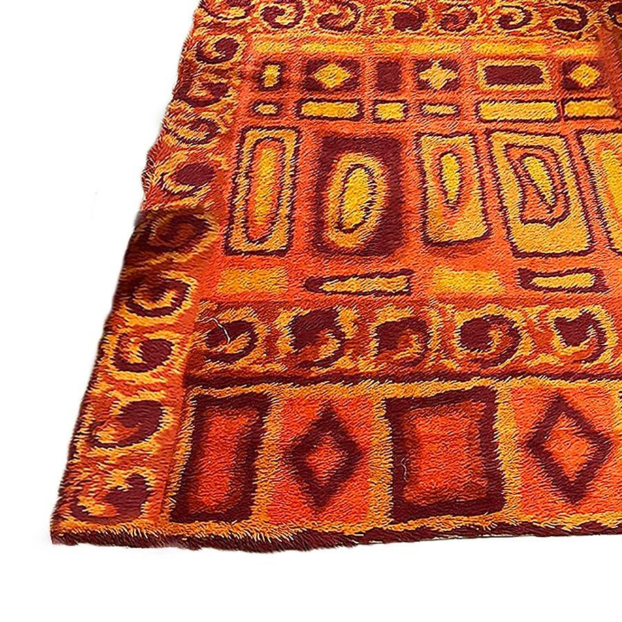 Deep pile Mid-century shag area wool sag rug with abstract design in various shades and shapes of Red, Orange, brown, and burnt orange. It is an excellent piece for accenting your room with color-infused textiles.

Scandinavian rugs are decorative
