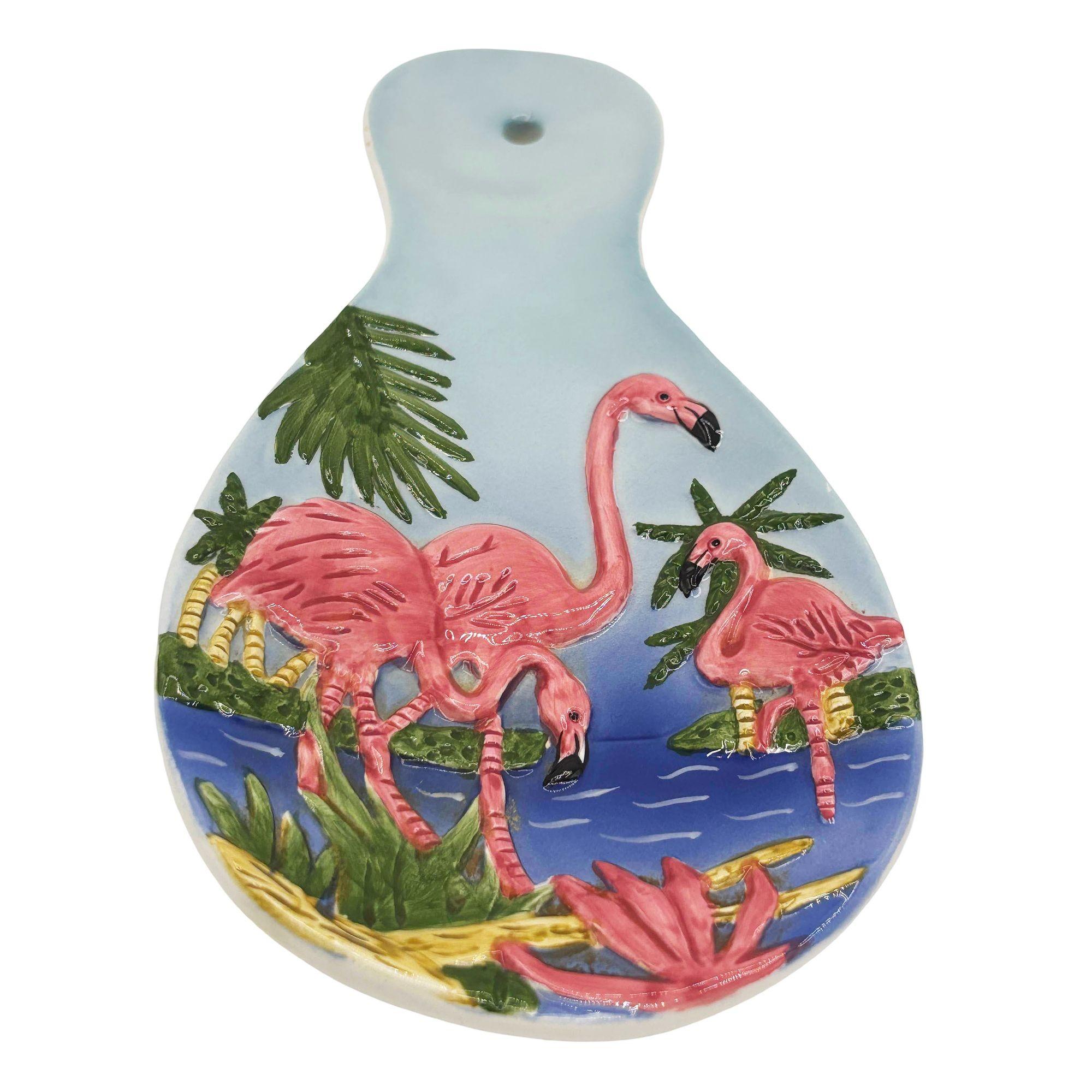 Mid-century Era pink and green 3d Flamingo ceramic spoon rest with several flamingos enjoying a beach holiday. The Spoon Rest features a beautifully detailed pink flamingo flock with blue sky and sandy beaches. It comes in a gloss finish that