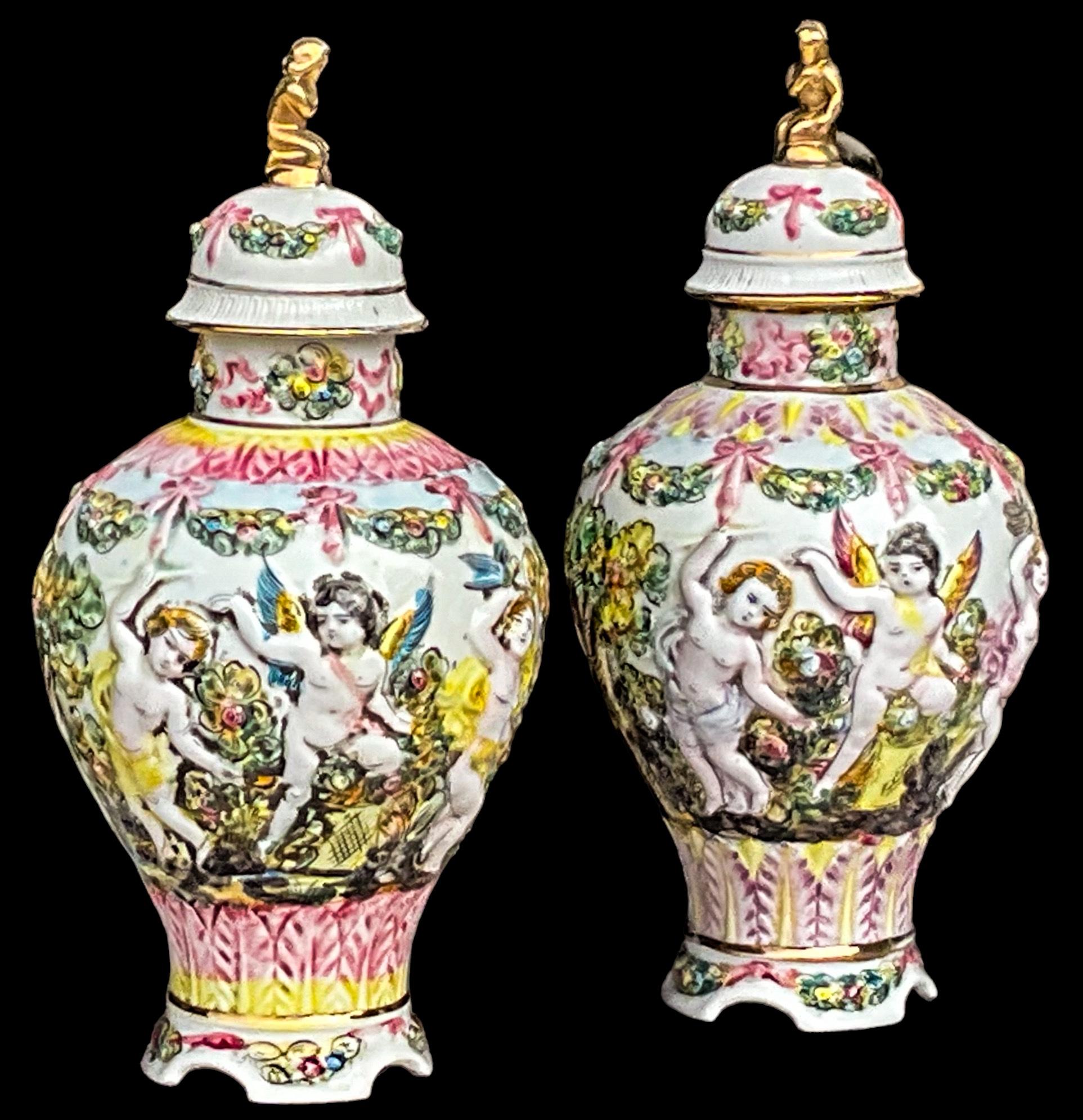 This is a pair of rococo style Italian Capodimonte pottery and gilt hand painted ginger jars. They are marked and in very good condition. 