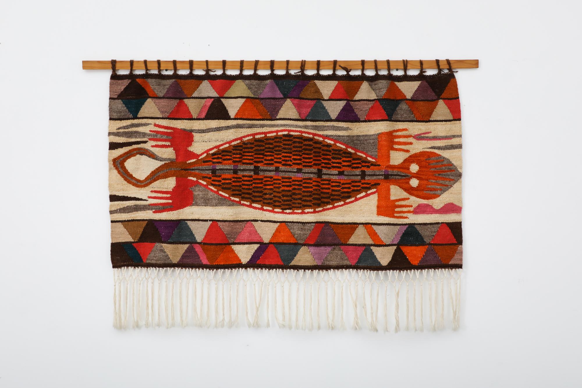 Woven wool tapestry with primitive design made from Ecuador. This Salasaca piece, named after the small Equadorian town known for its exquisite tapestries, is part of a long standing tradition where the colorful, loom-woven designs  were hand dyed