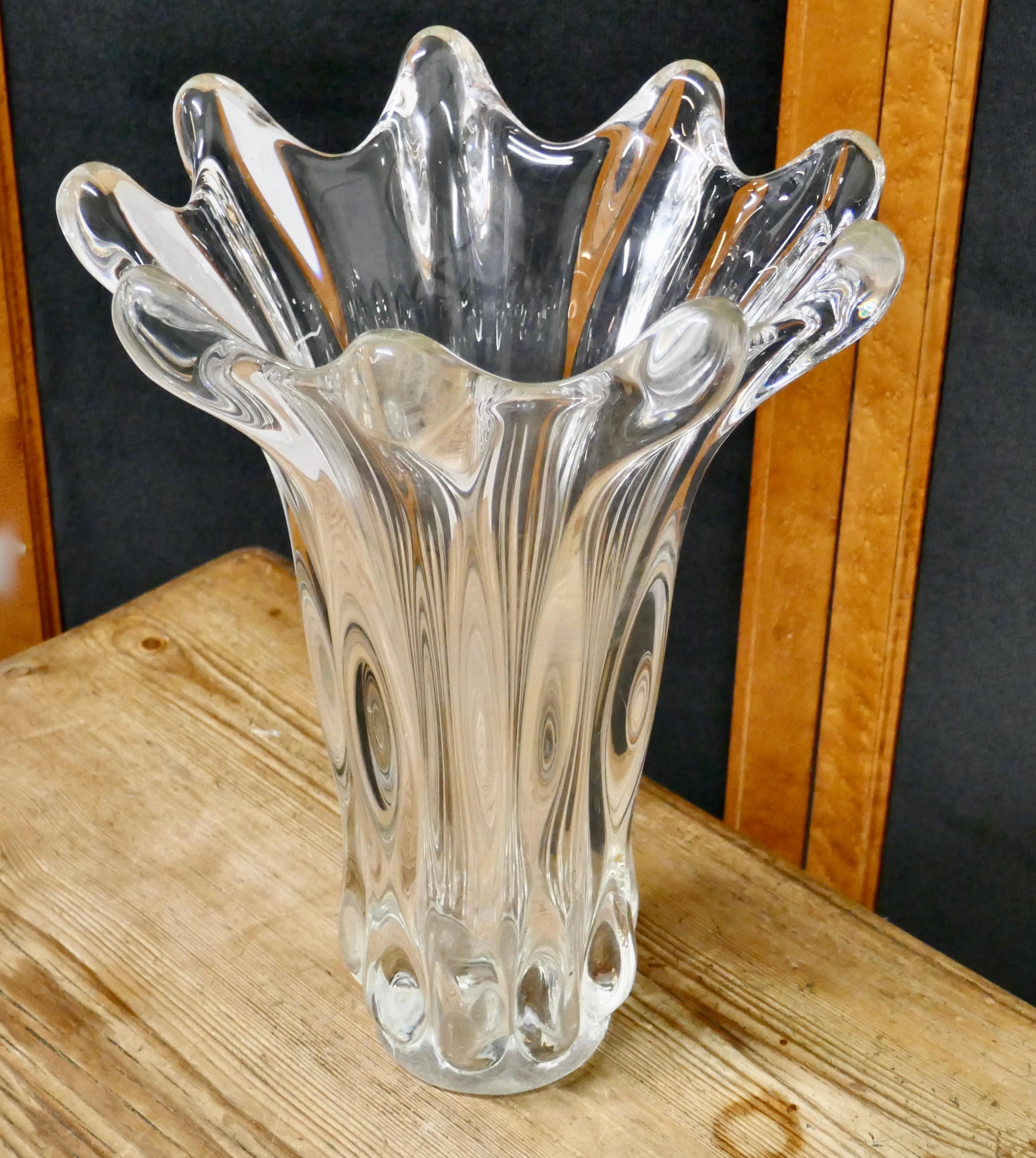 Midcentury hand blown crystal vase by Art Vannes
 
A stunning very heavy piece in natural crystal in a stylized floral shape design, made in the 1950s and marked Vannes Art on the bottom
The vase is in good condition, no chips cracks or repairs