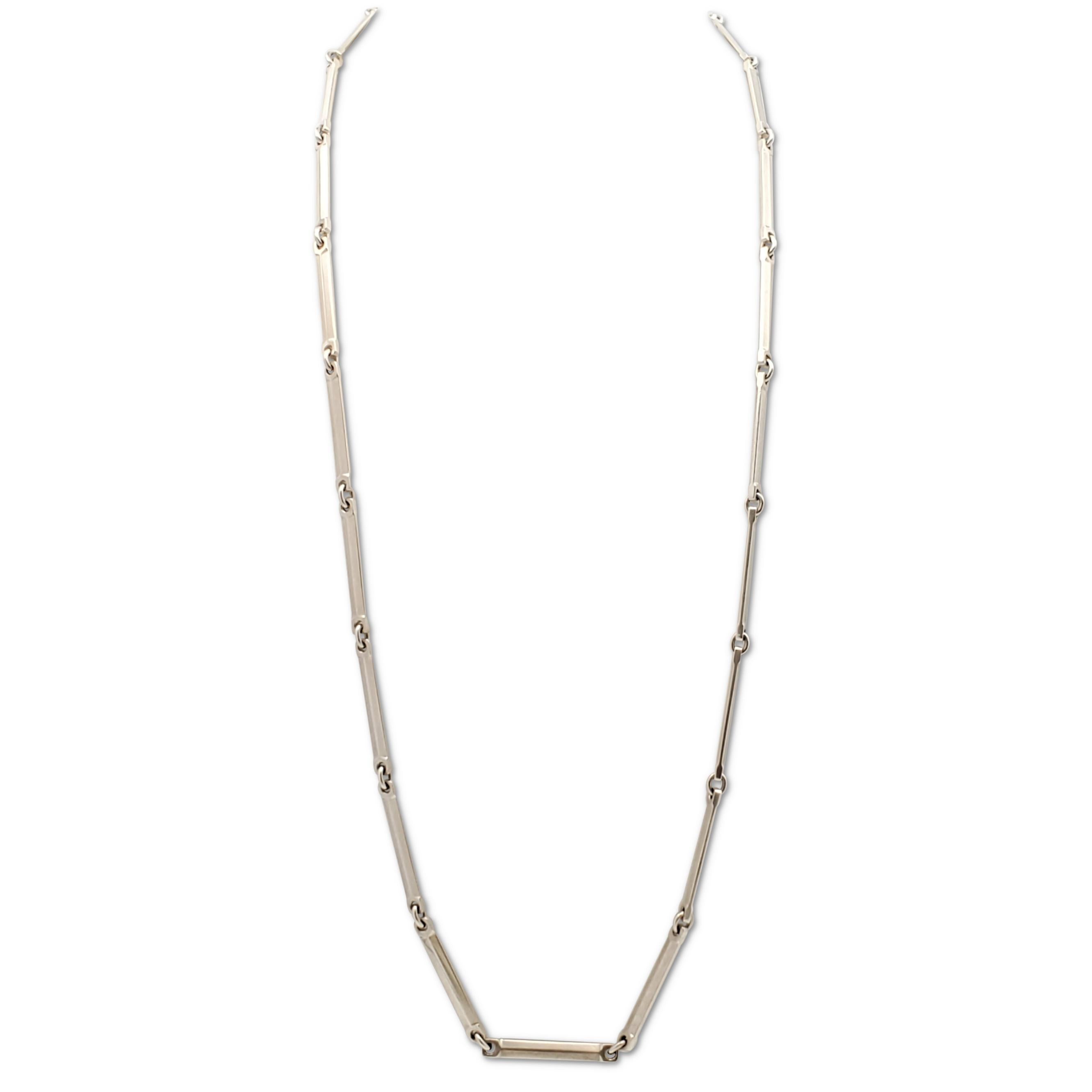 Authentic Mid-Century Hans Hansen necklace crafted in sterling silver is comprised of sleek bar-like links. Signed HaH, 925S, Denmark. The necklace measures 36 inches in length. Not presented with the original box or papers. CIRCA 1960s.

Necklace