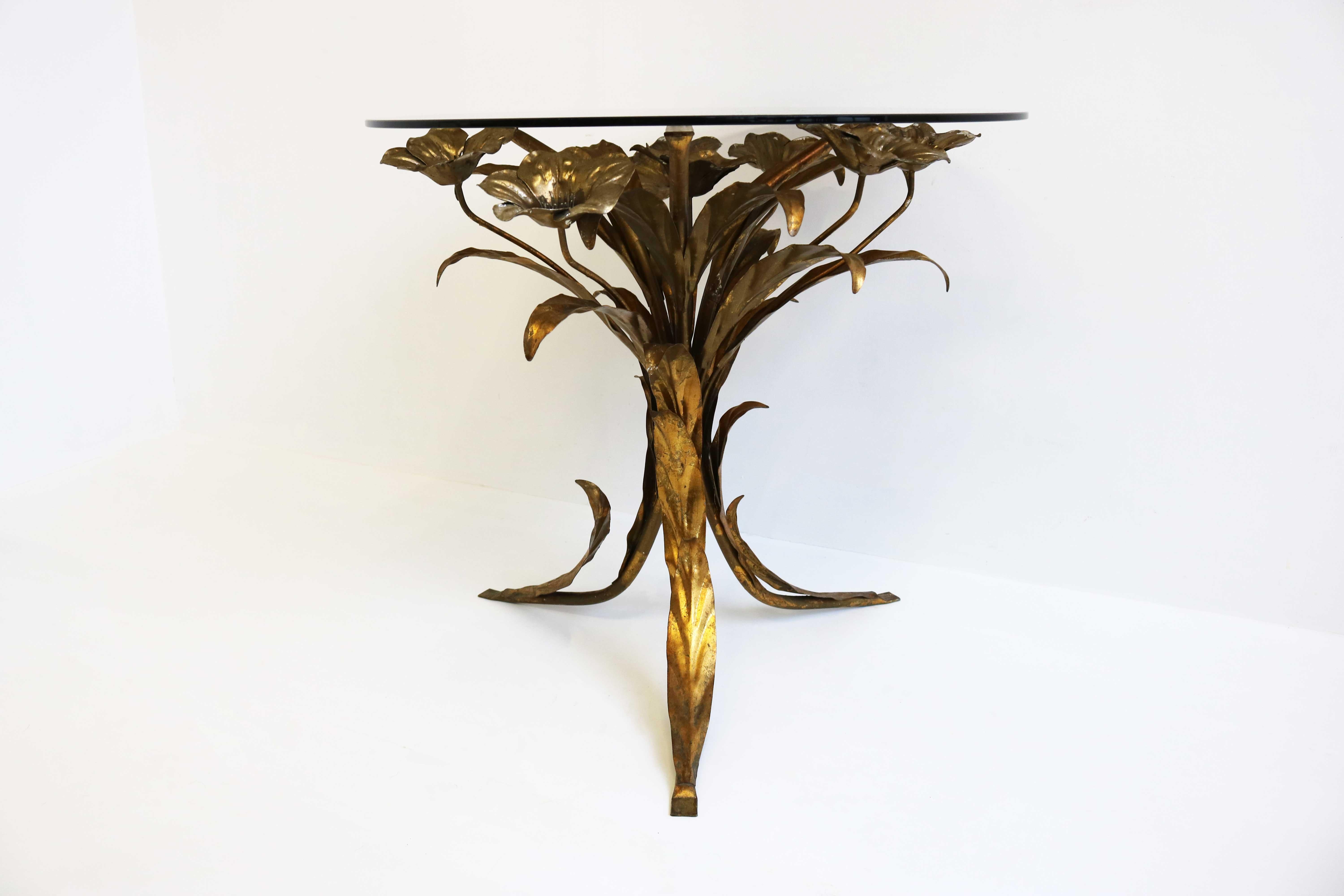 Stylish & timeless ! This beautiful decorative gilt metal side table by Hans K�ögl, 1960’s Germany.
The elegant roses / flowers are silver gilt. On top a smoked round glass. Creating a gorgeous combination that always draws your attention
Very