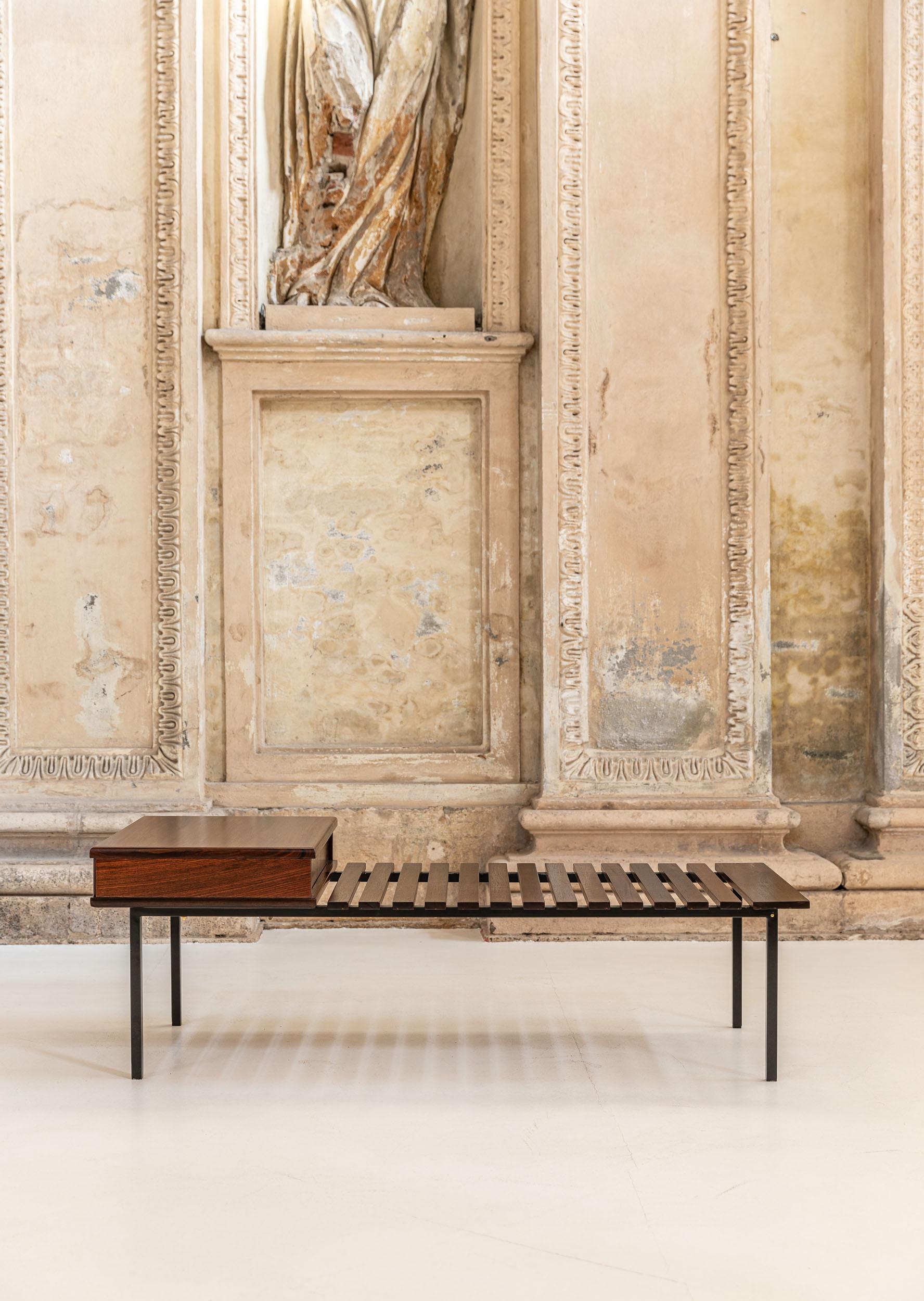 Mid Century wooden and metal bench attributed to Stildomus. 
Elegant bench with metal structure, the seat is composed of wooden boards and a side drawer.
The drawer cas also be used as a table or support.