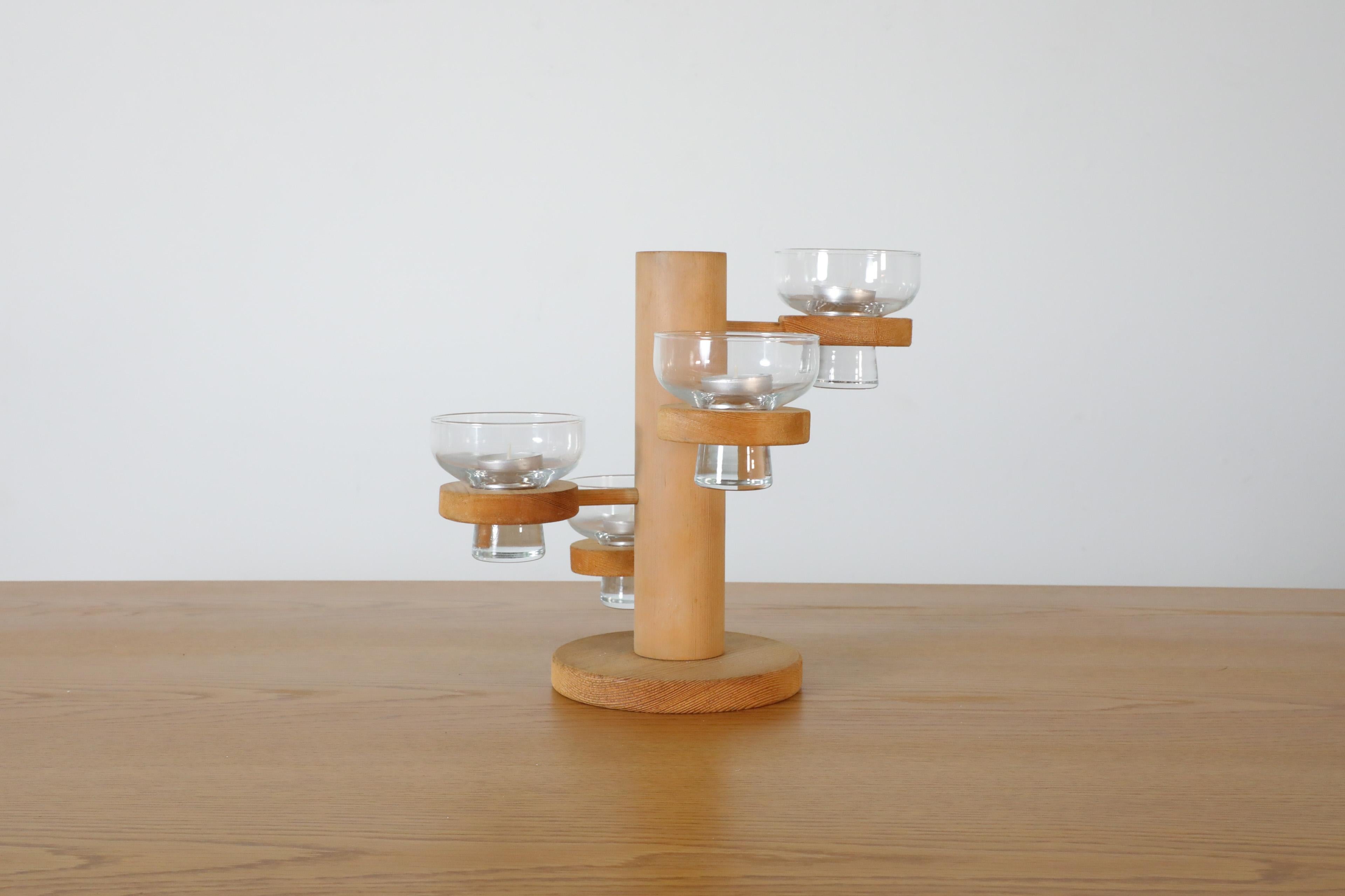 Danish Mid-Century multi-level pine candle holder with glass dishes by Harlyk Denmark, 1960's. This well designed piece will serve beautifully as a centerpiece and can be used to hold a variety of things other than candles. In original condition
