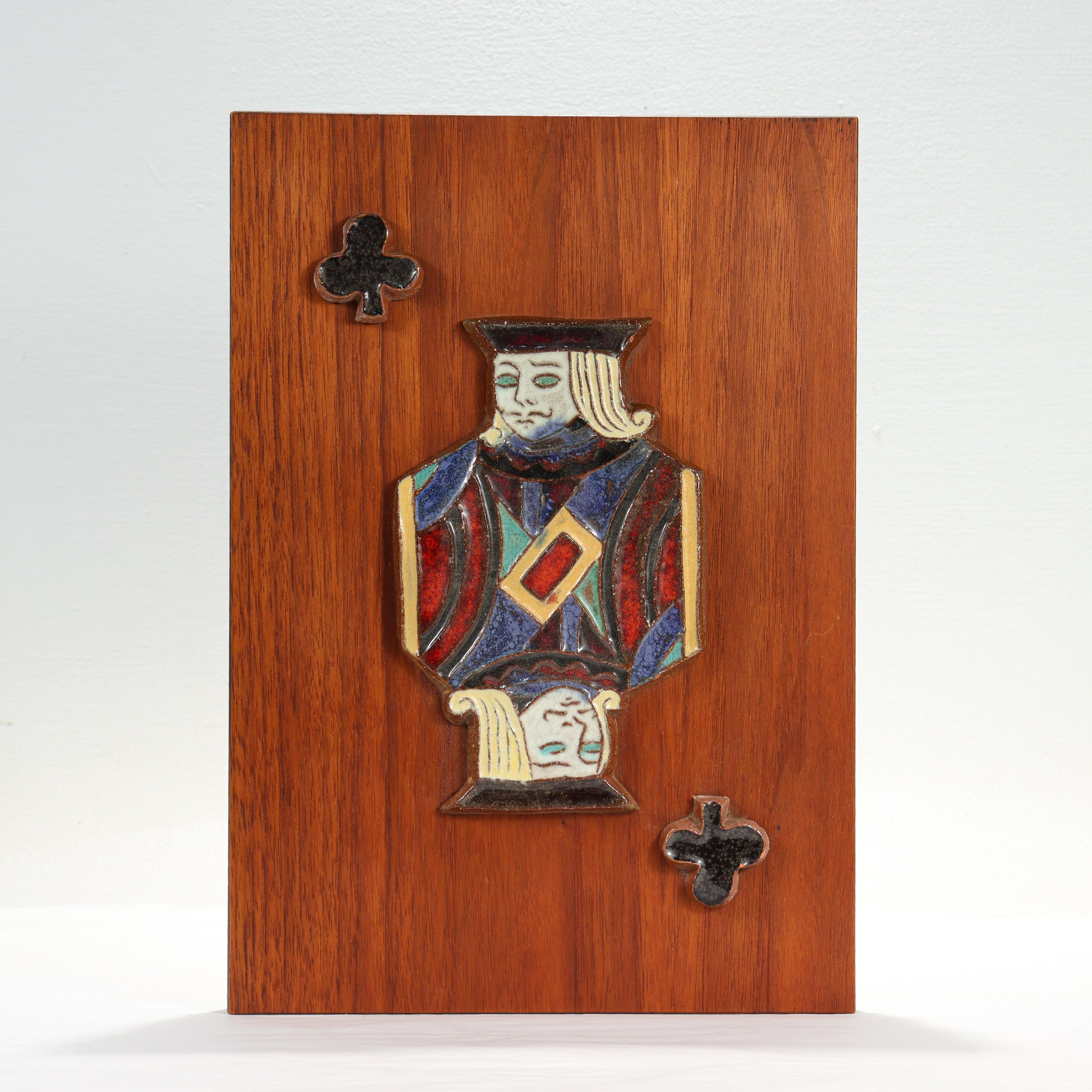 A fine Mid-Century Modern pottery tile.

By Harris Strong. 

With a terracotta pottery tile depicting the Jack of Clubs mounted on a teak veneered panel.

Simply a great tile for any fan of card games!

Date:
Mid-20th Century

Overall Condition:
It