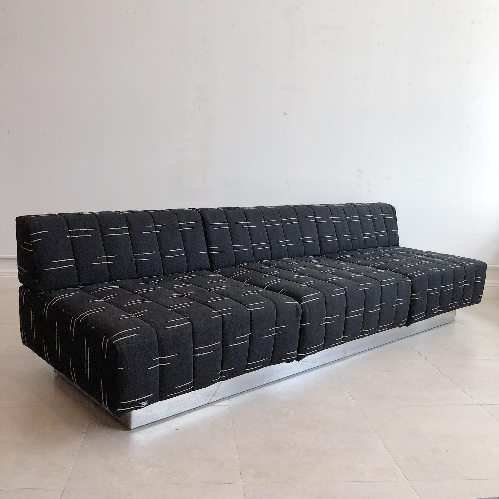 1960's vintage Harvey robber 3 seat sofa with steel over wood plinth base. In original as is fabric.