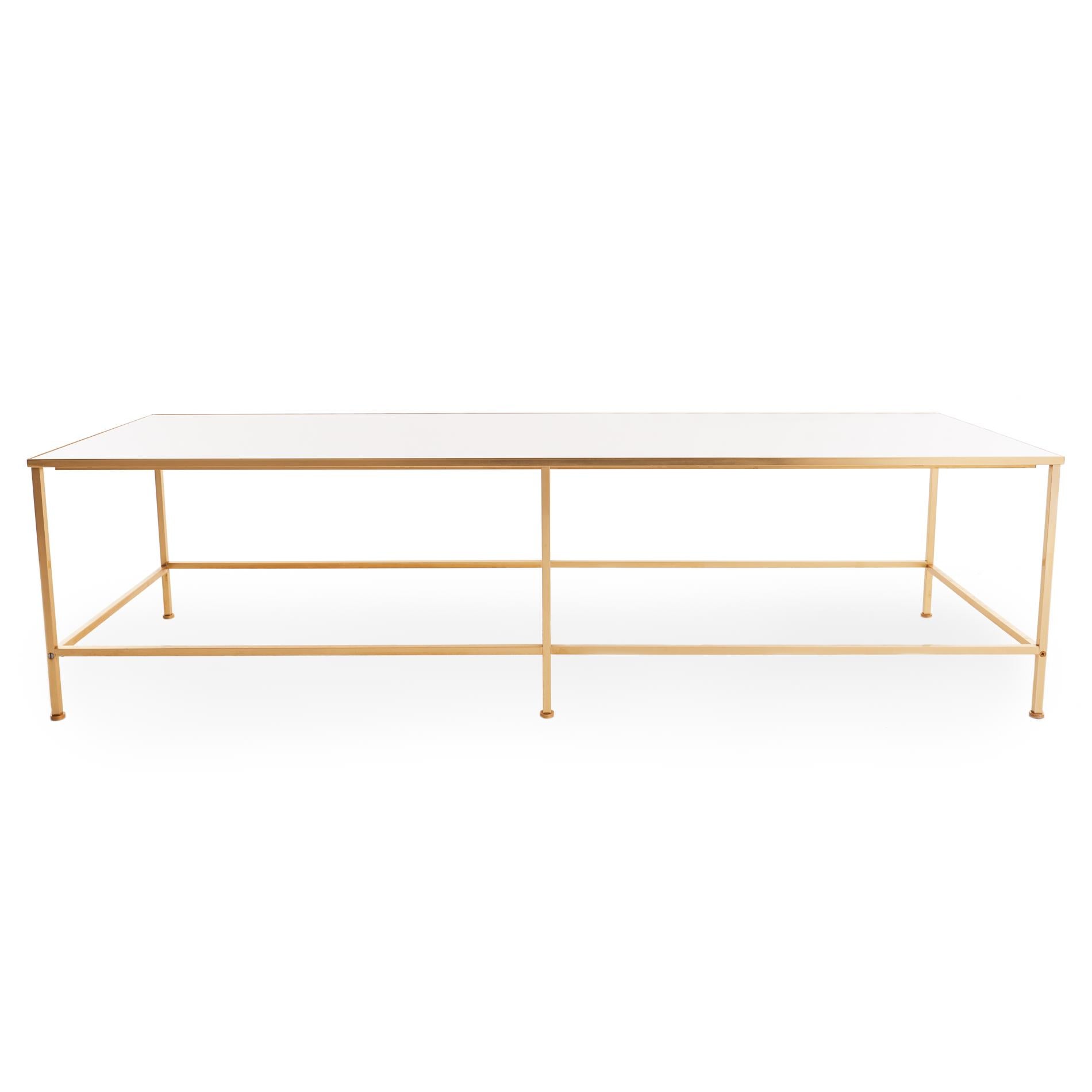 Sleek midcentury coffee table with substantial white vitrolite top inset into a brass frame, in the style of Harvey Probber. Overall in incredible shape, with a small hairline crack in one corner (see images).

Measures: 16